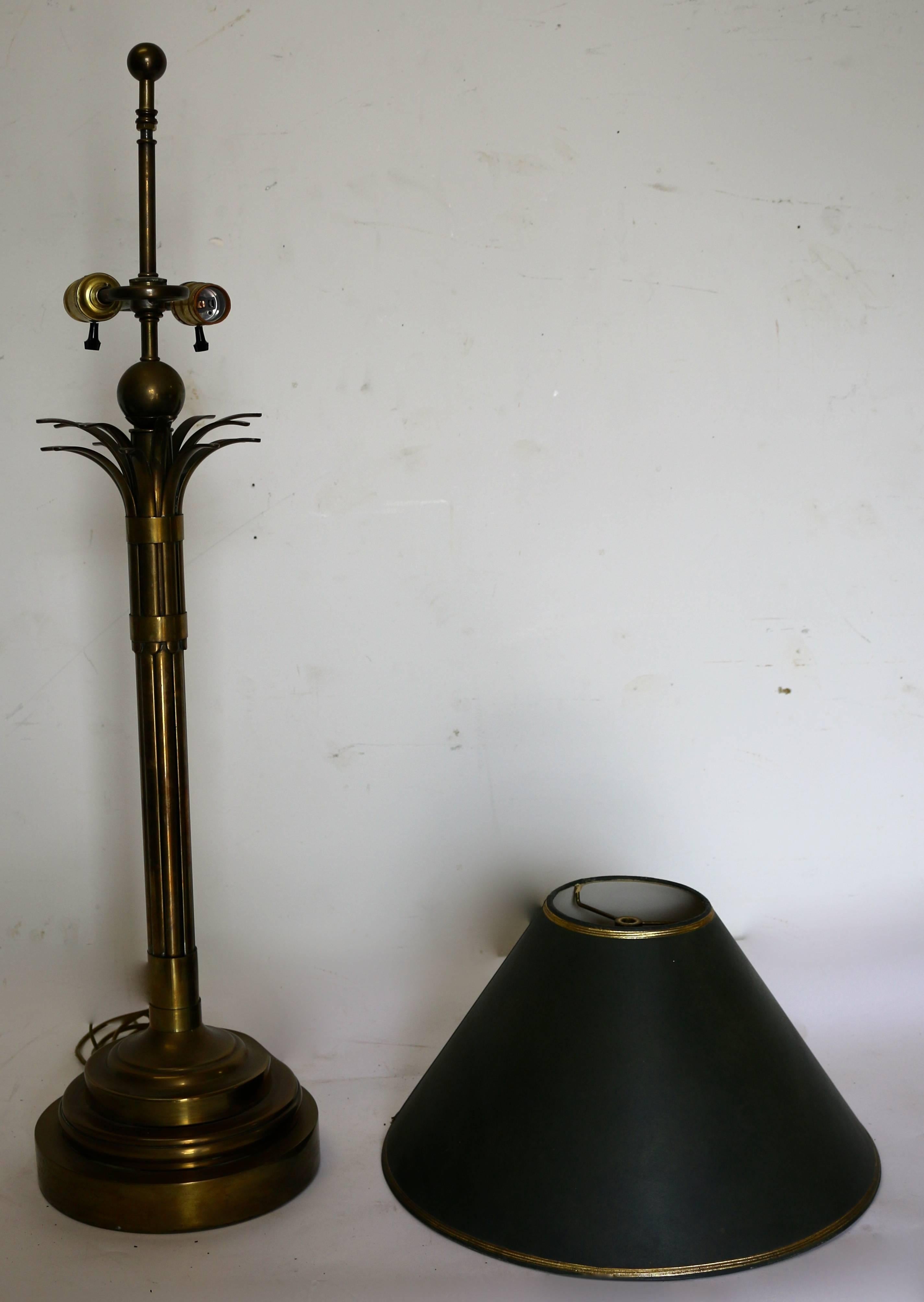 A Mid Century, Modern Brass Stylized Palm Tree Table lamp.
a combination of Modern sensibility with a traditional subject.
In Excellent used condition.
Shade measurements are 16' w Bottom and 5.5'top.