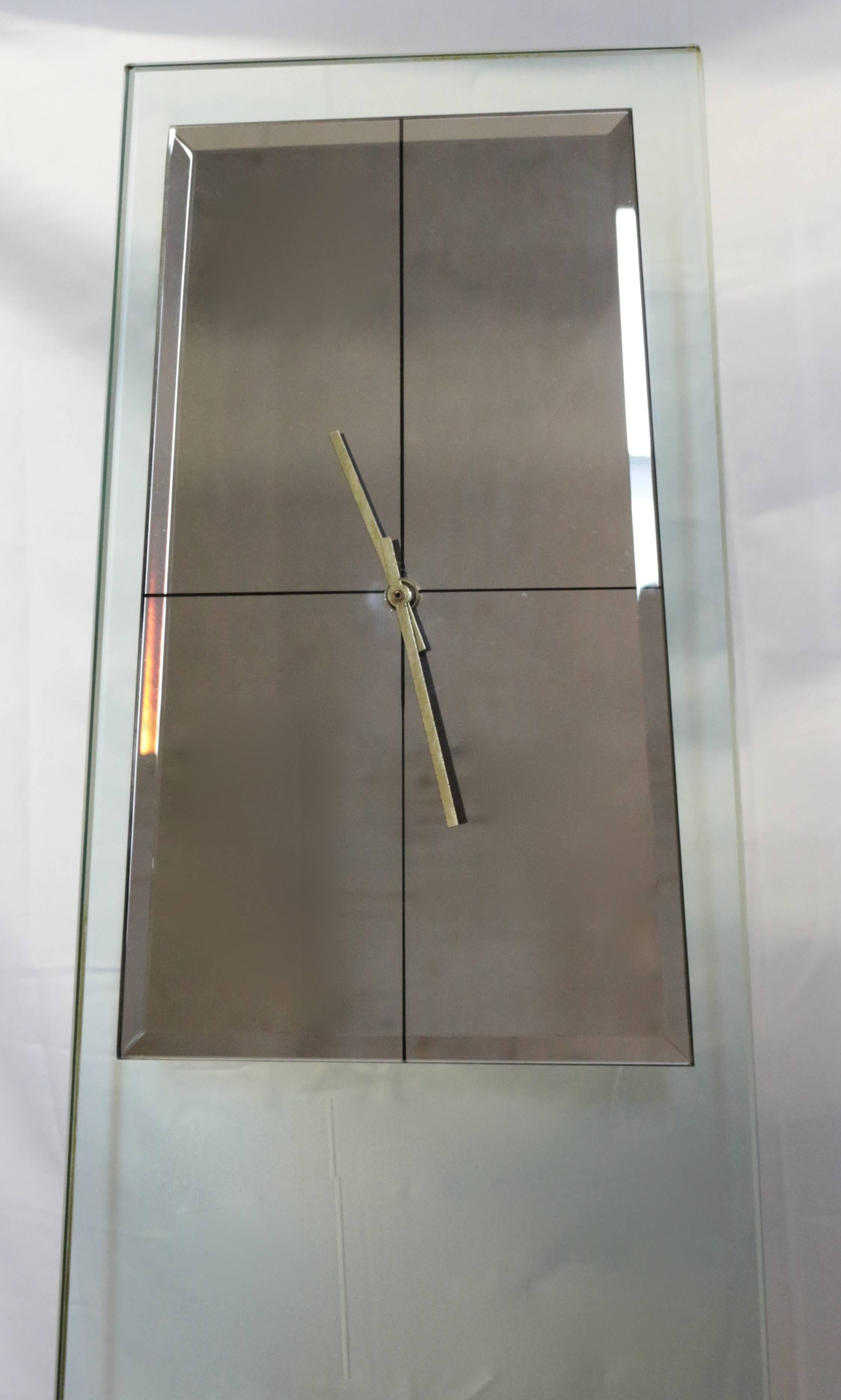 Tall Mid-Century Modern sleek transparent Kienzle floor clock with mirrored face in excellent used condition.