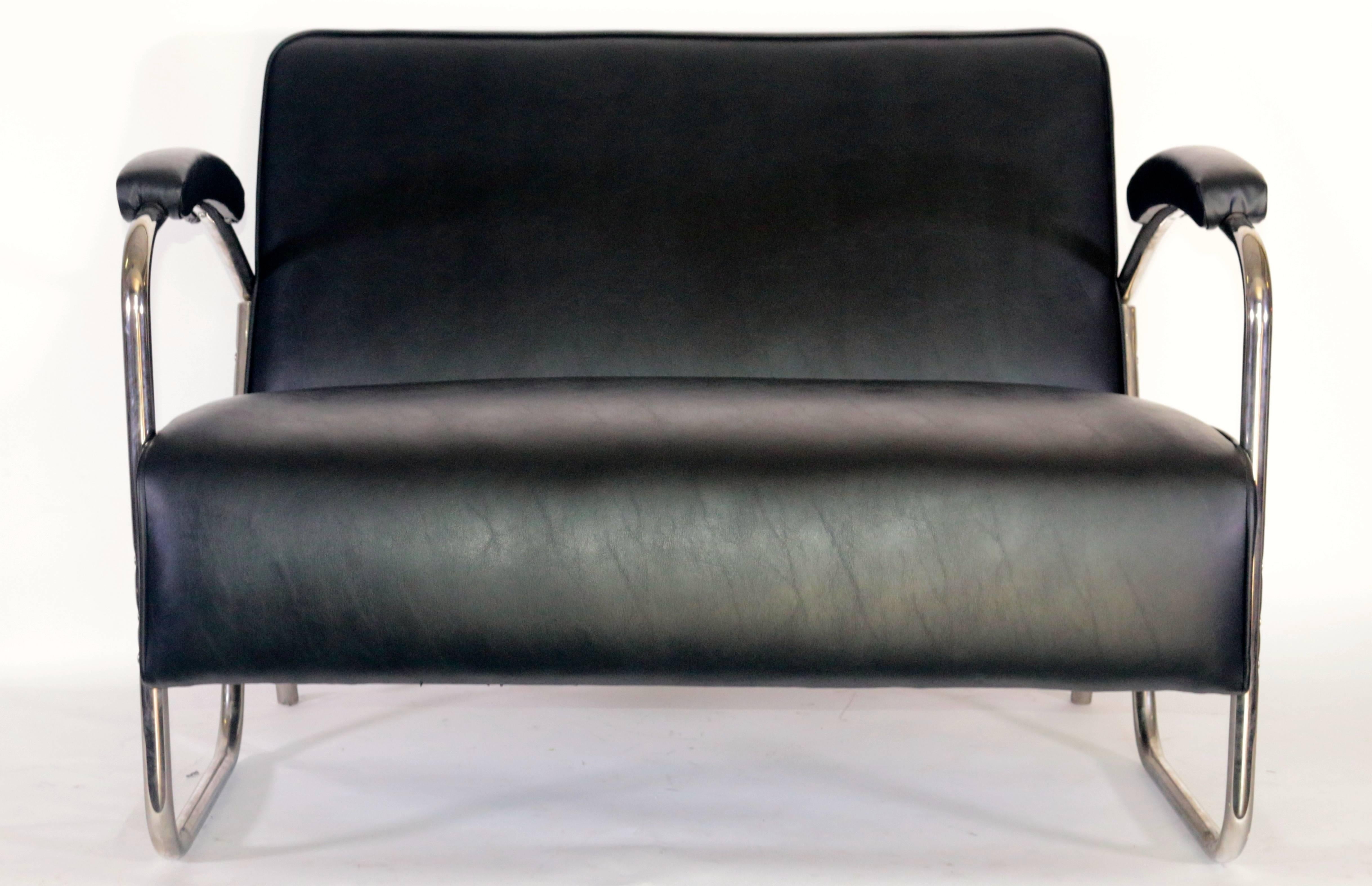 A pair of modern midcentury chrome leather sattees chairs in excellent used condition.