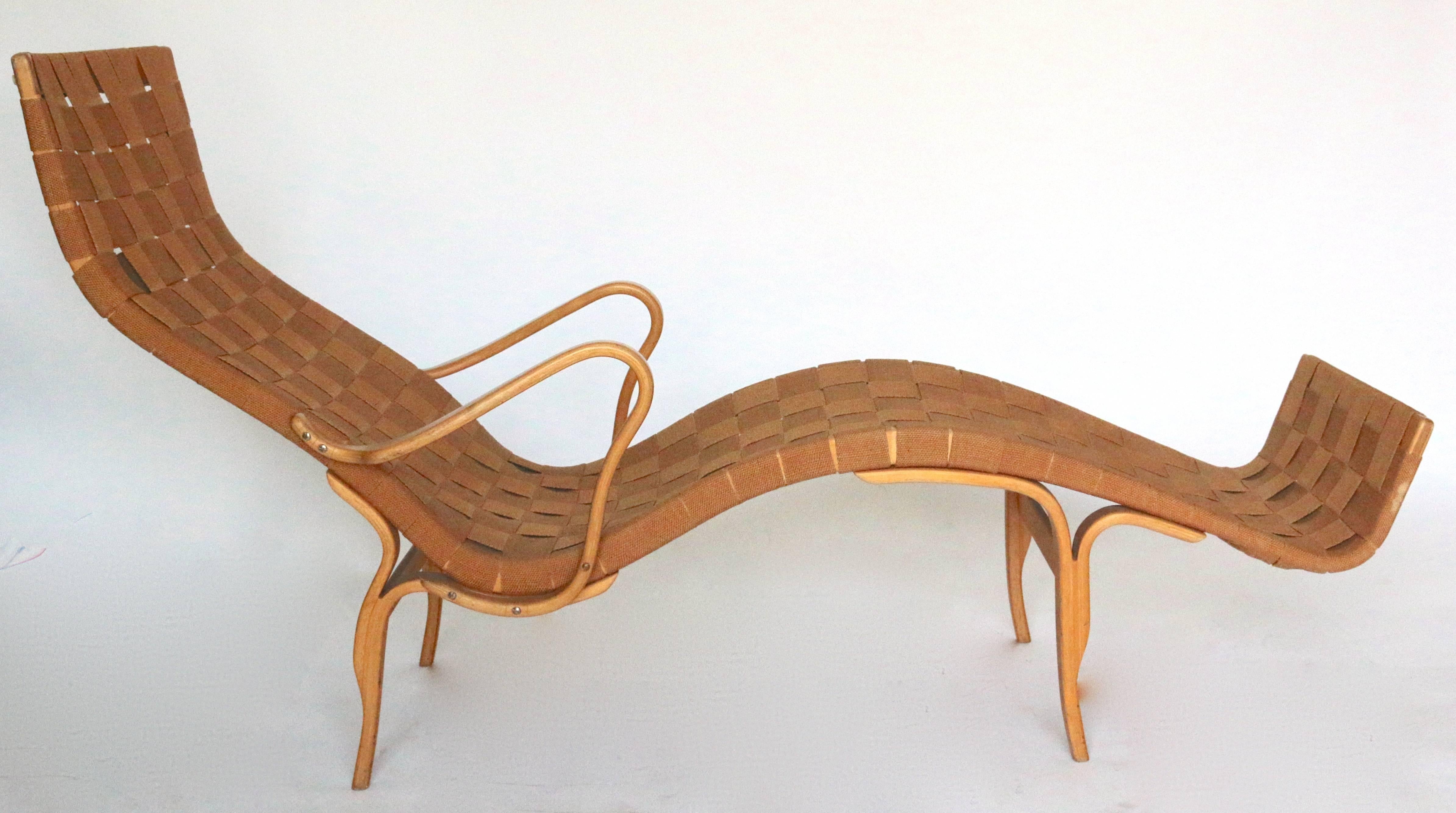 Mid-Century Modern Lounge chair Designed by Bruno Mathsson.
Made in 1961 by Karl Mathsson in Varnamo, Sweden.
Solid birch frame with bentwood beech arms and legs 
with all original webbing in excellent used condition.
Signed by maker, imprinted