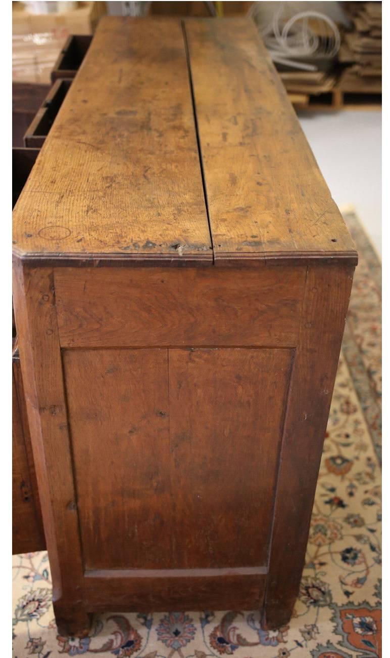 18th century Italian sideboard, with drawers and two cupboards. Original hardware, one missing knob, one missing keyhole. 
Has not been refinished, original patina.

 