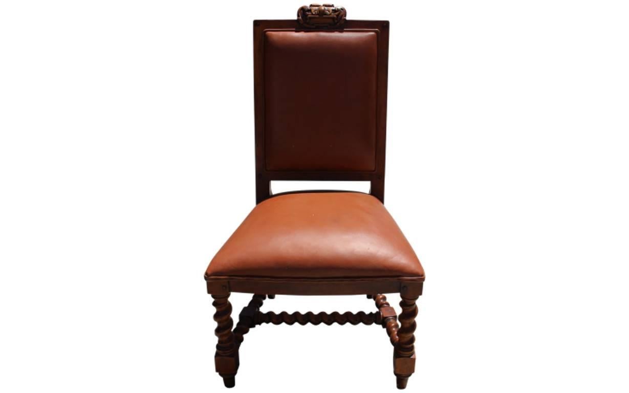 These exquisite Ralph Lauren side chairs reflect the famous label's attention to detail and quality. The wood legs and trim are intricately carved and the plush seats are upholstered in buttery leather. Sold in a set of four.