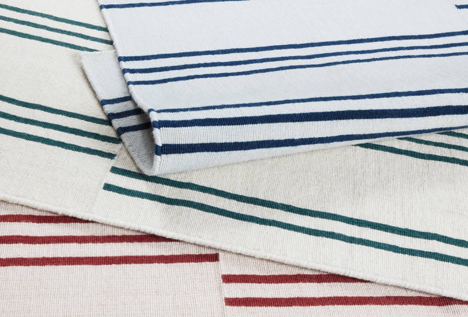 Stripes Ice/Blue is a modern dhurrie/kilim rug in Scandinavian design. It is available in different sizes - see customization options below.

The brick patterned stripes gives the rug a unique expression and the soft colors beautifully complements