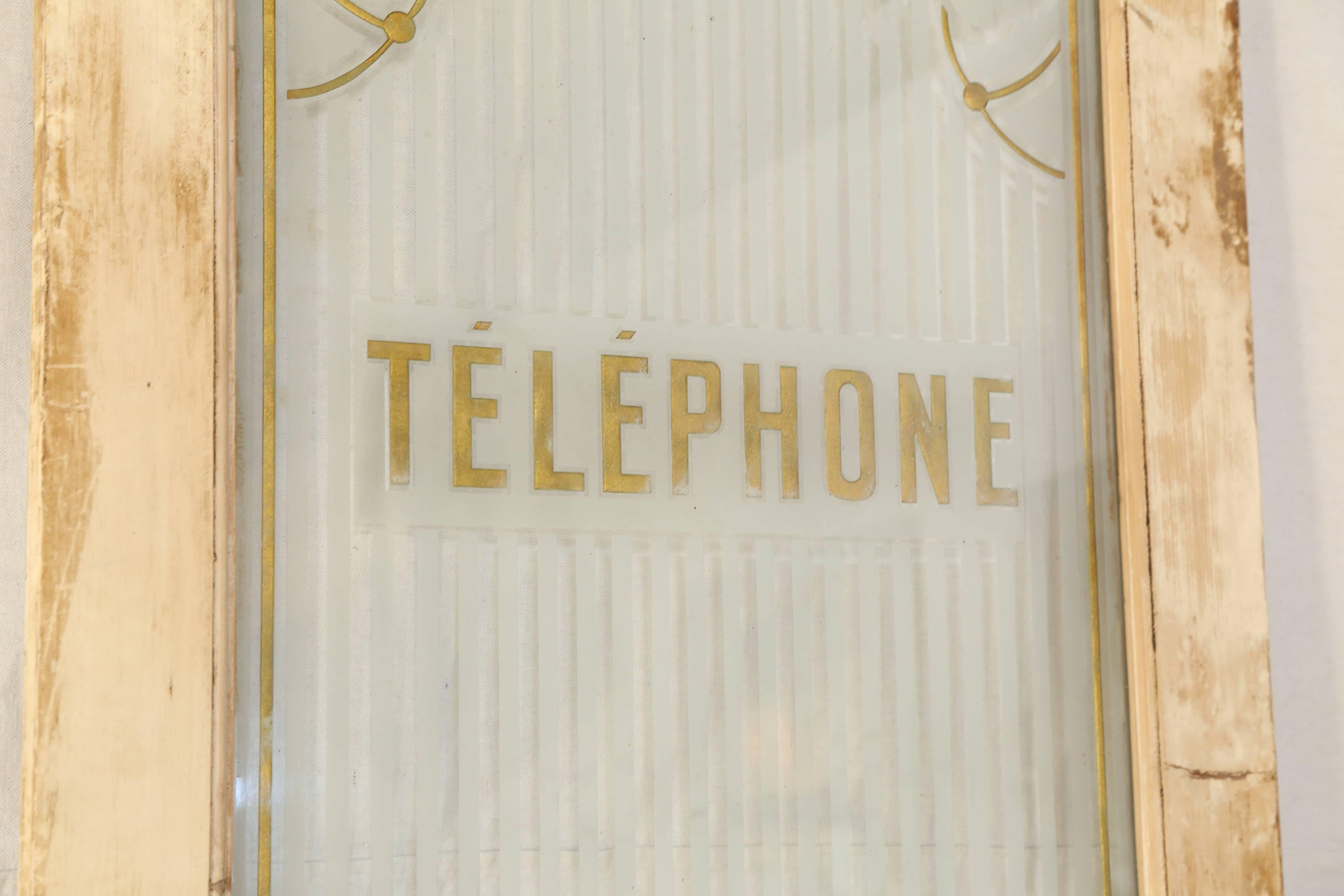 Etched, carved and gold leafed glass in the Art Nouveau style inscribed with the word 'Telephone' set in a hardwood door. The door is constructed using visible square cut nails and is sturdy in every regard with no cracks or splits. The door retains