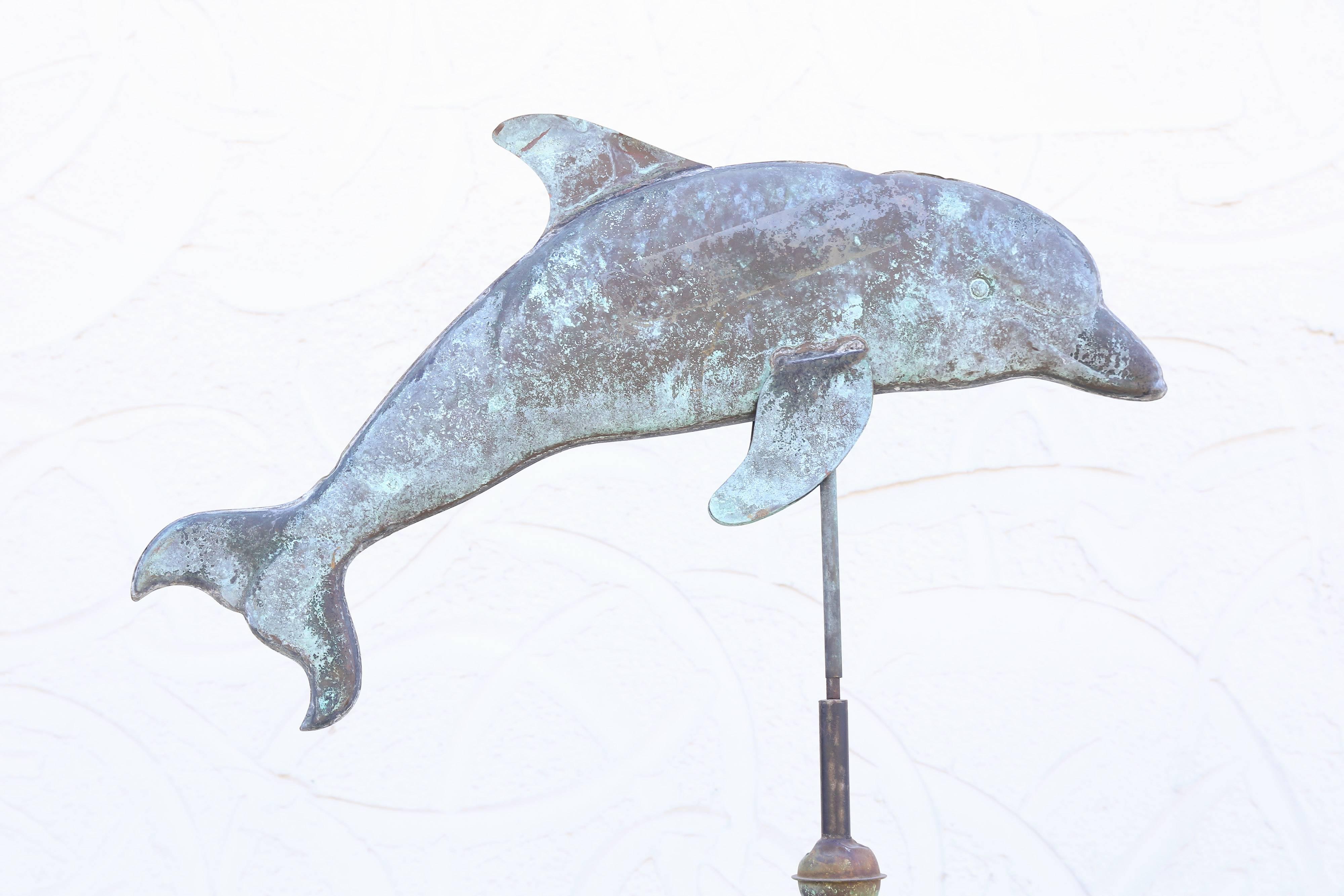 Weathered copper and iron weathervane with a beautifully detailed dolphin and directional on a custom metal base. Large and impressive.