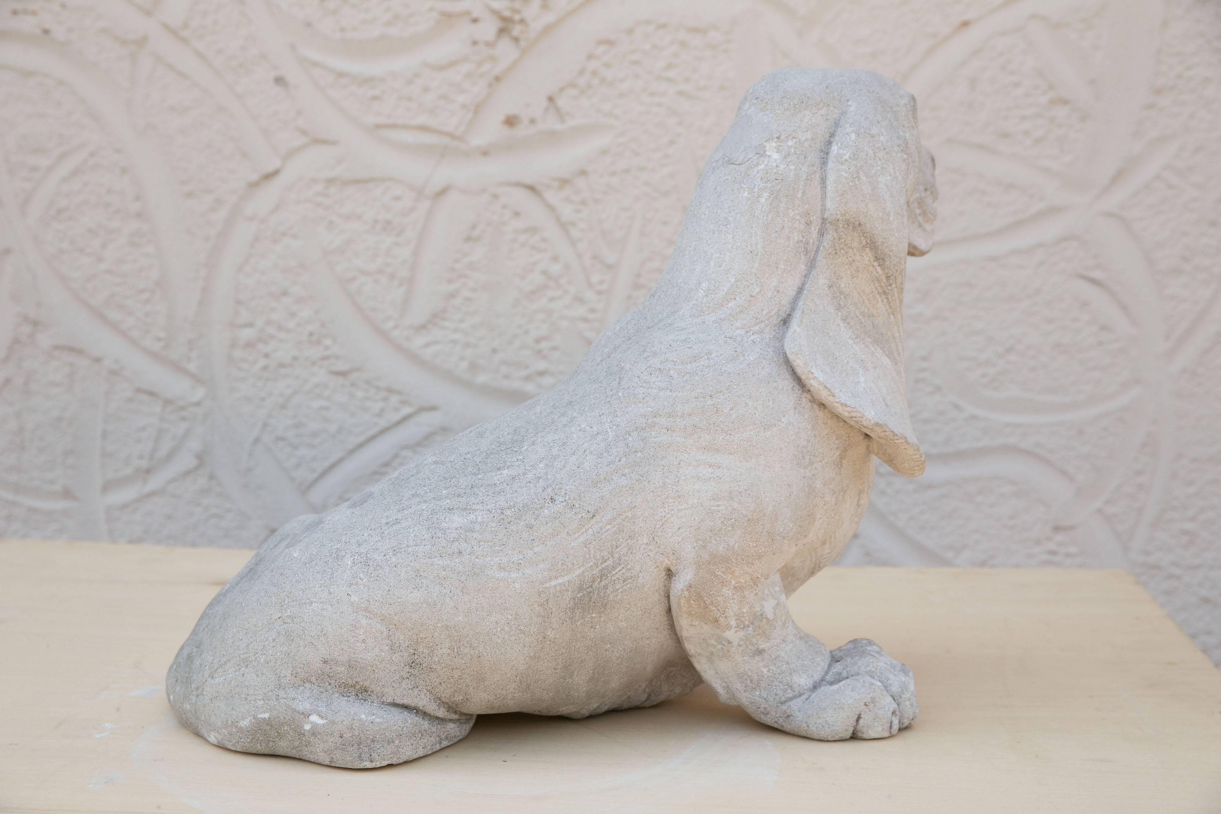 A concrete statue of a proud and lovable basset hound to stand guard over your house or garden. Wonderful details.