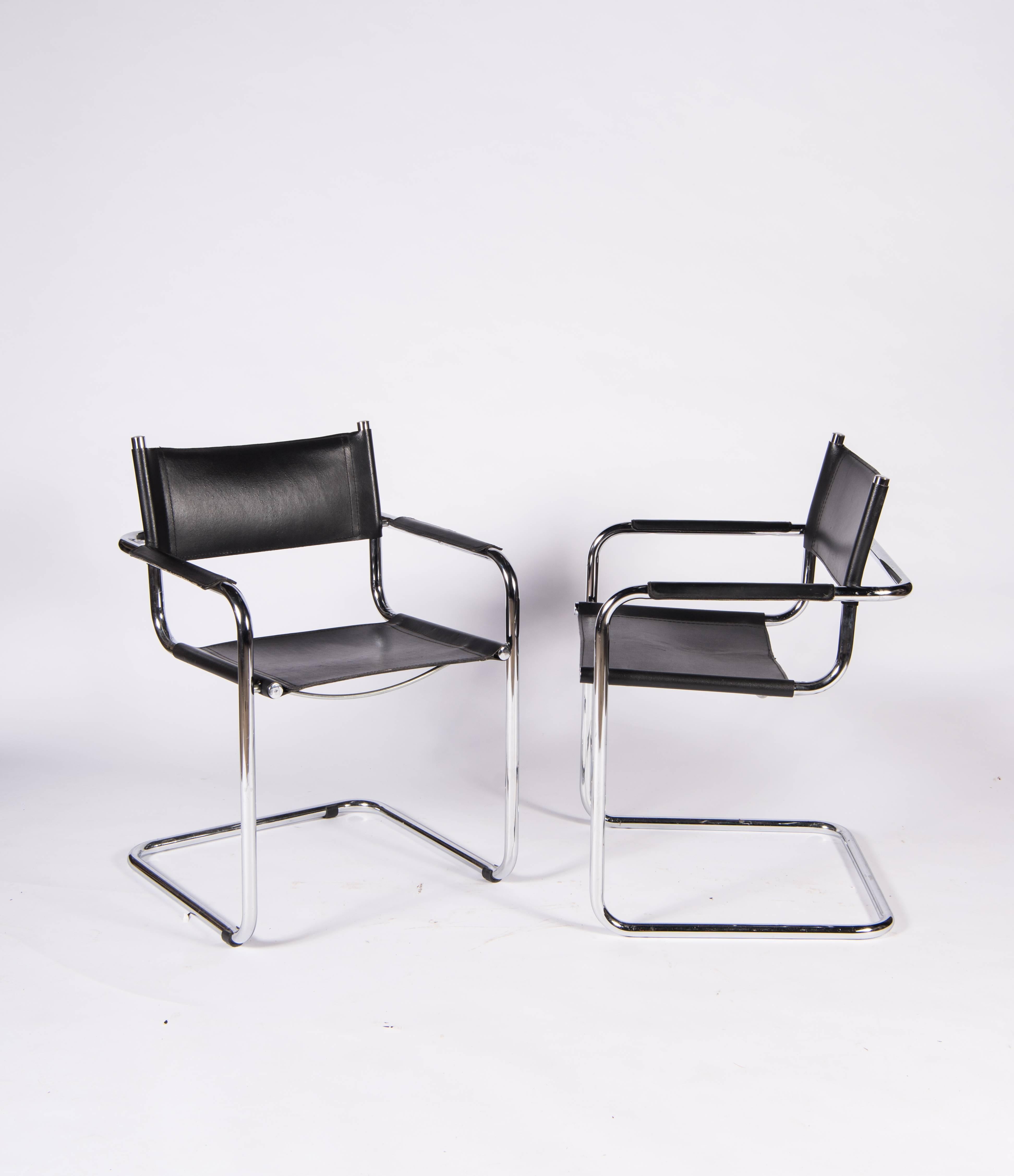 Four iconic cantilevered armchairs of chrome tubular steel with black leather sling seat and back and black leather armrests in near pristine condition.
Designed by Mart Stam in 1927, chairs of this style were the first cantilevered chairs in