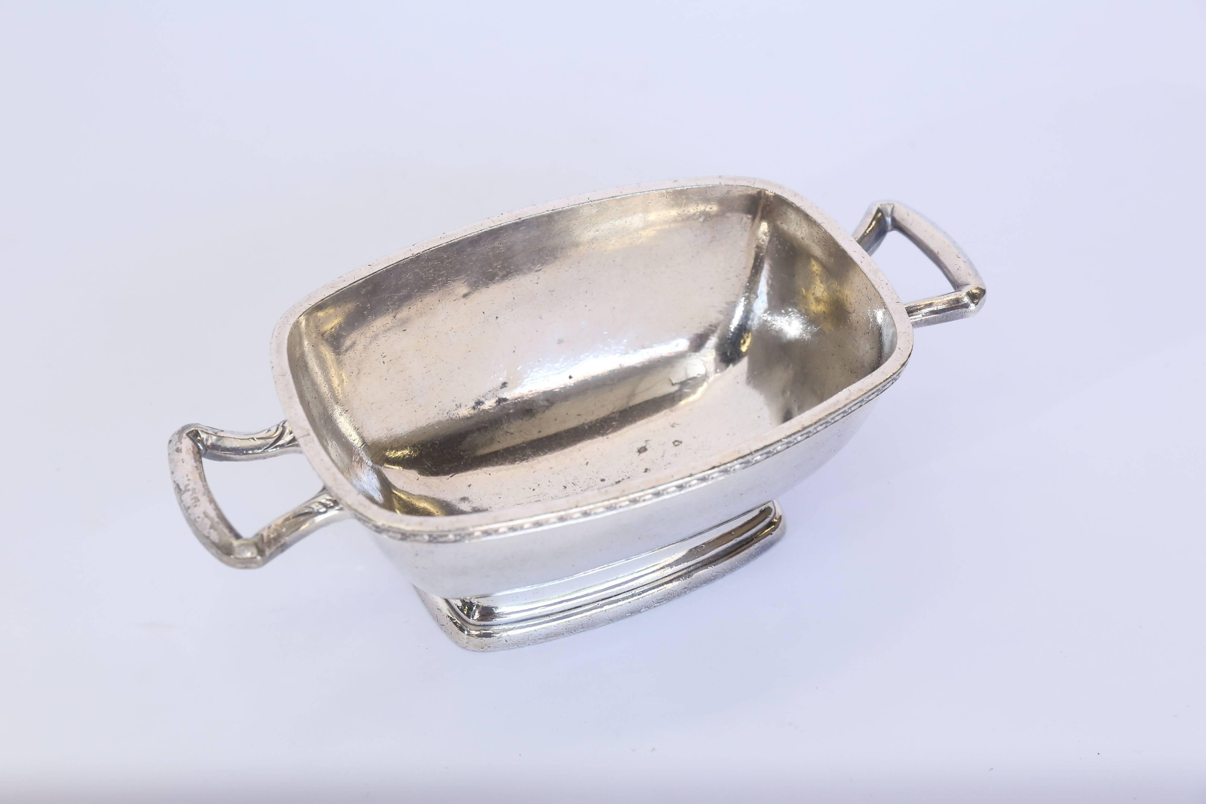 Made by L.Barth & Company, a rectangular nickel silver dish from the iconic Warwick Hotel. Marked 'The Warwick' 02165, 32 Oz, Patented April 13, 1926, a silver soldered piece with Deco inspired styling that is unusually heavy. One small unnoticeable