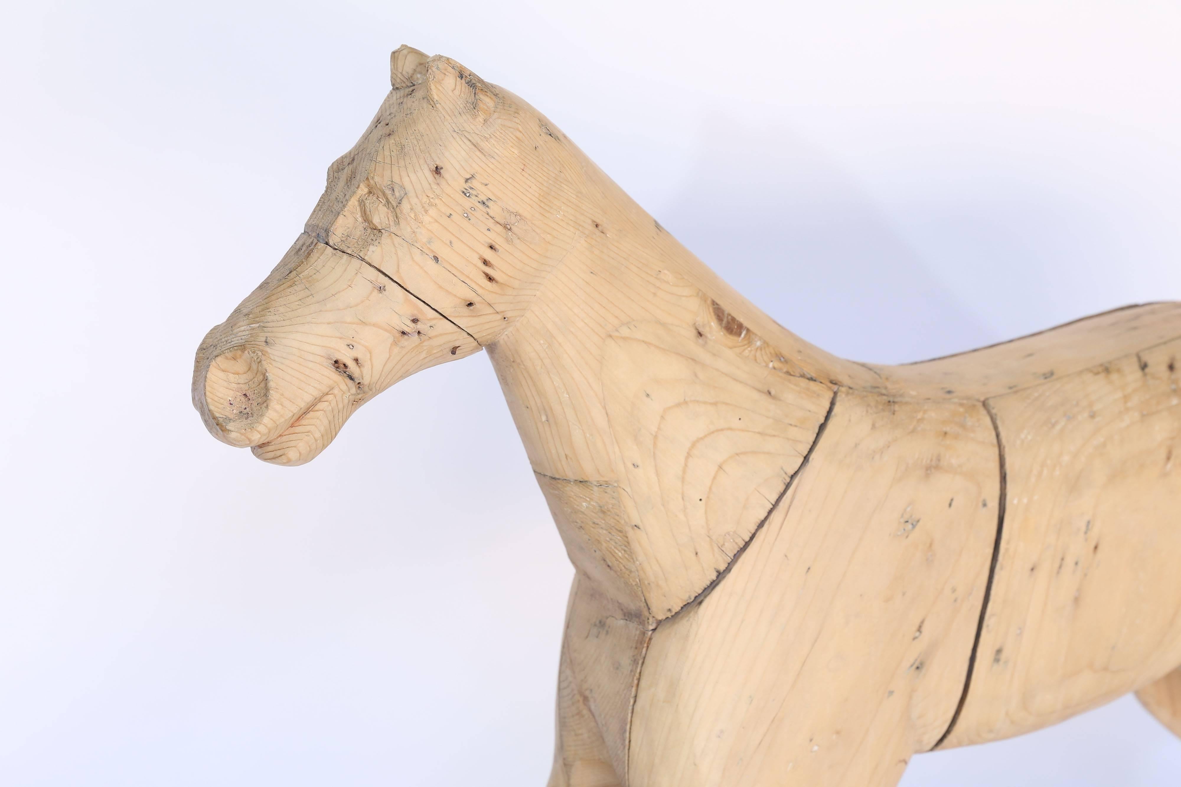 This Antique Wooden Horse is carved in sections and then fitted together like a puzzle. Something different for the collector. 