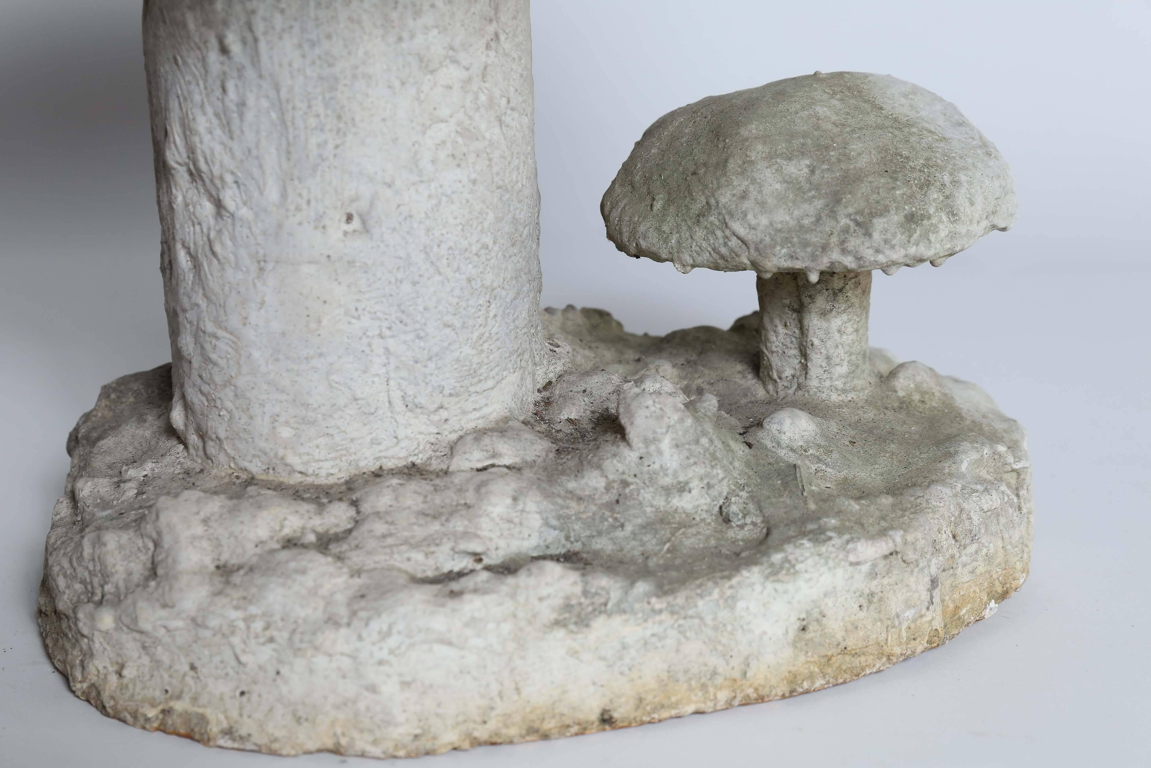 Found in France, two magic mushrooms in concrete stand ready to add a note of whimsy to the garden.