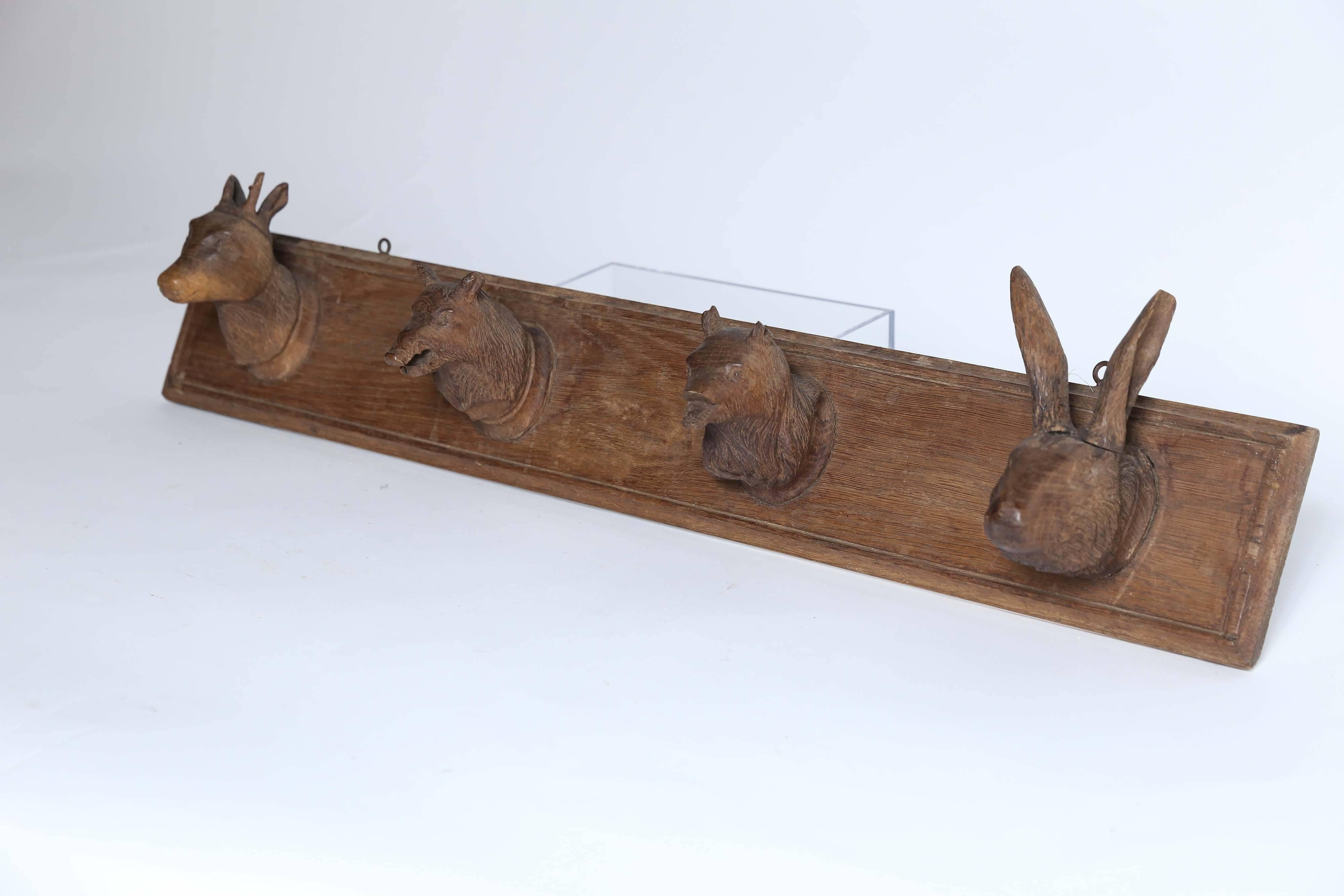 A deer, a boar, a bear, and a rabbit invite you to hang your hat and stay awhile. Charming hand-carved Black Forest hat rack.
 