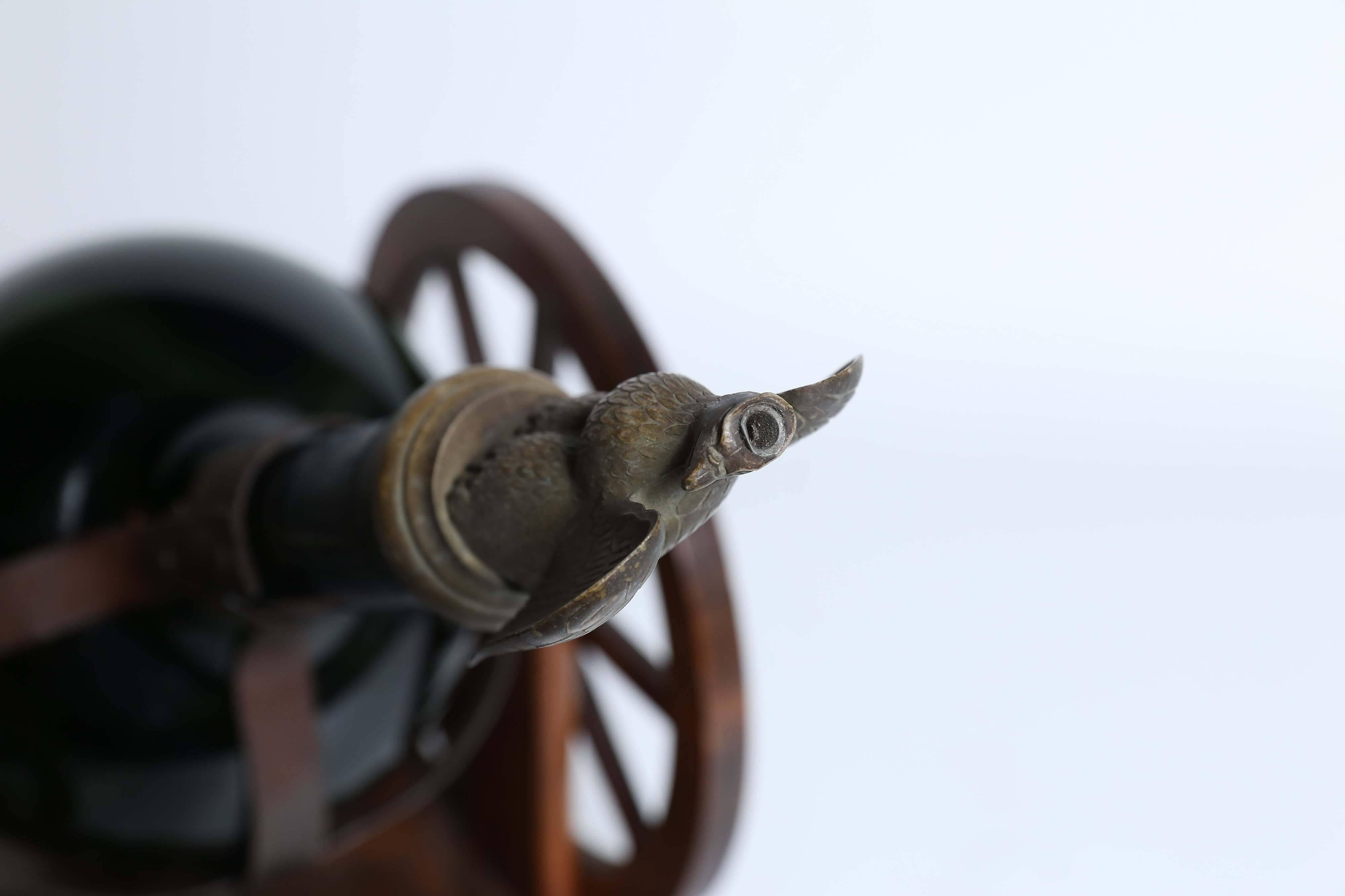 A vintage Courvoisier gun carriage in near pristine condition holding an empty
Courvoisier bottle with a metal eagle stopper. Courvoisier is known as 'The Cognac of Napoleon' and was served at the 1889 opening of the Eiffel Tower.