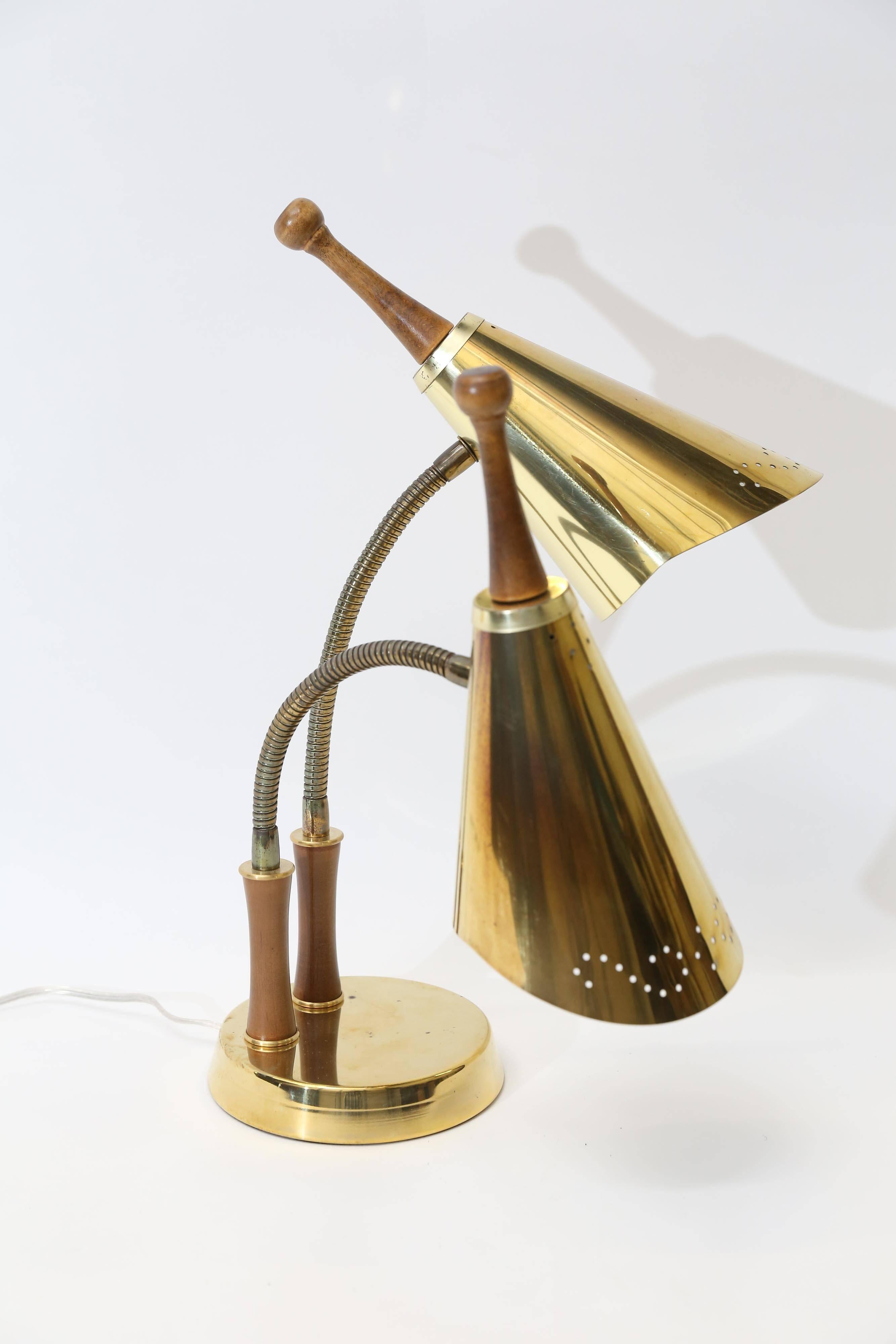 Wonderful Mid-Century Modern double gooseneck articulating lamp with pierced gold-tone metal shades and teak or walnut tips. Some tarnishing and a few blemishes. No dents.