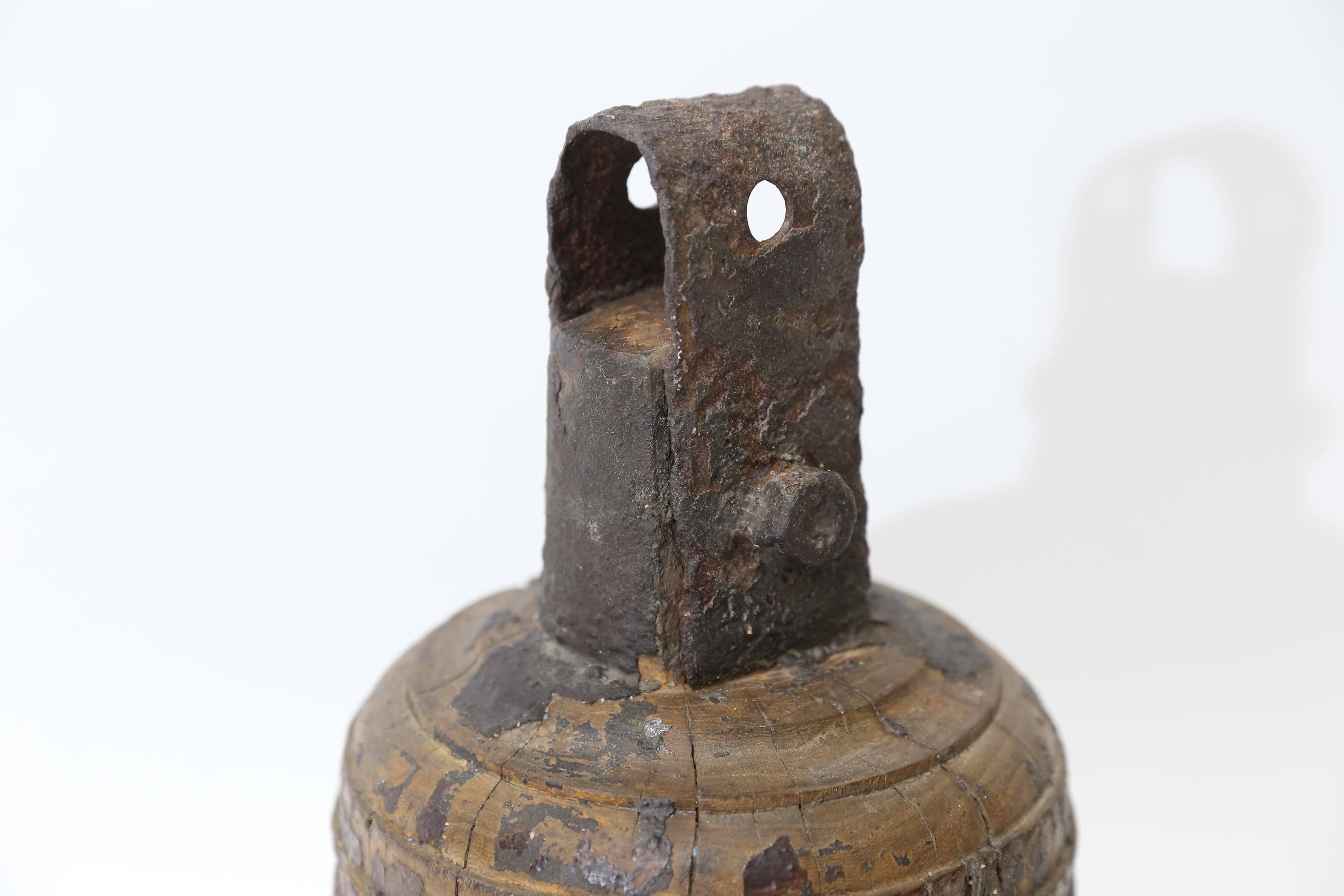 A hefty and imposing bell-shaped object from Sweden. It's original purpose is unclear but what is obvious is it's strong presence and curious appeal. Solid and heavy but with fabulous cracks and chips, it still has traces of a dark finish and it's