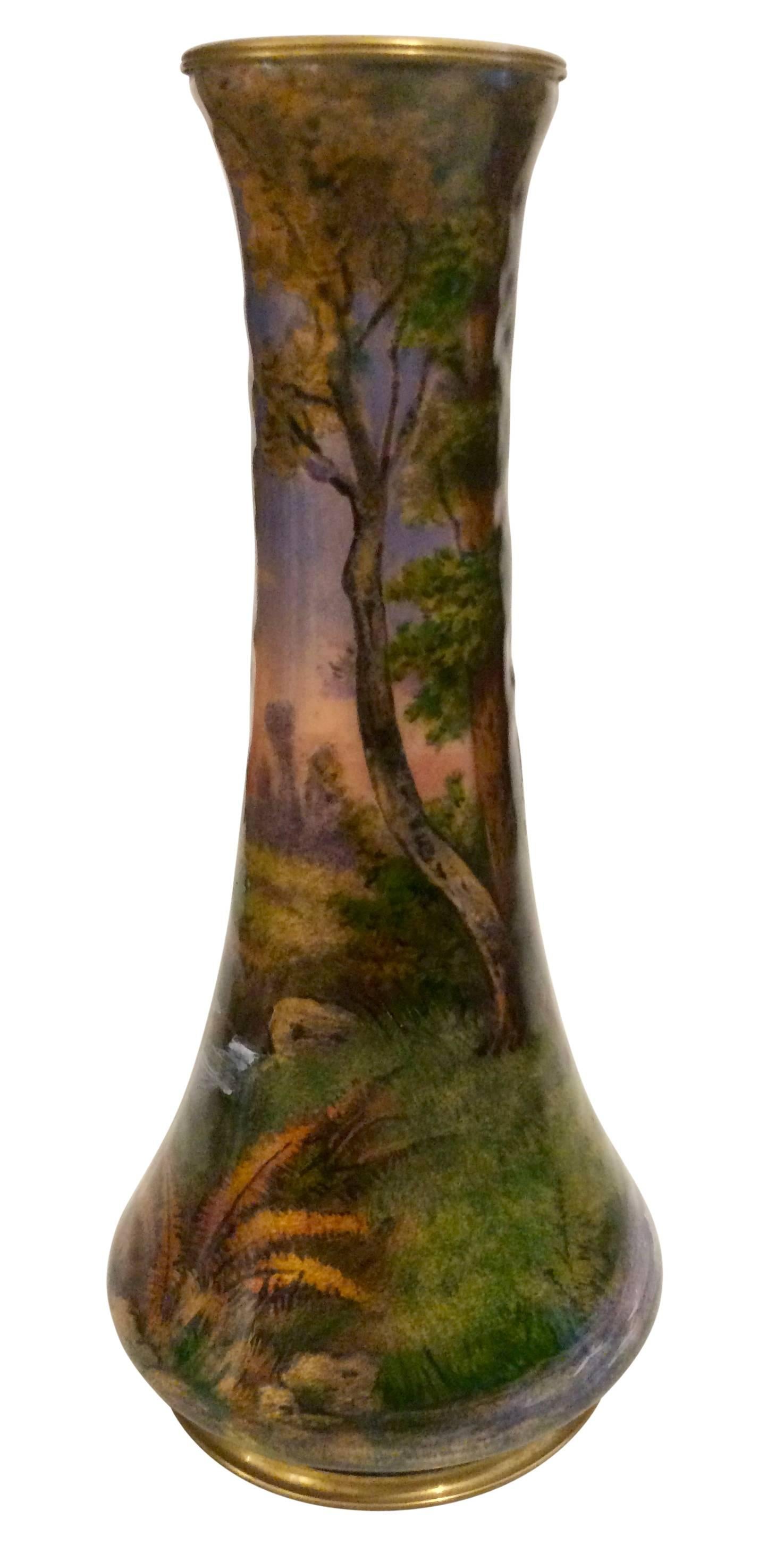 An exquisite French enameled copper vase,
circa 1920 signed by Jules Sarlandie. The artist has succeeded in bringing the hunting motive to the vase in this complicated technique.
   