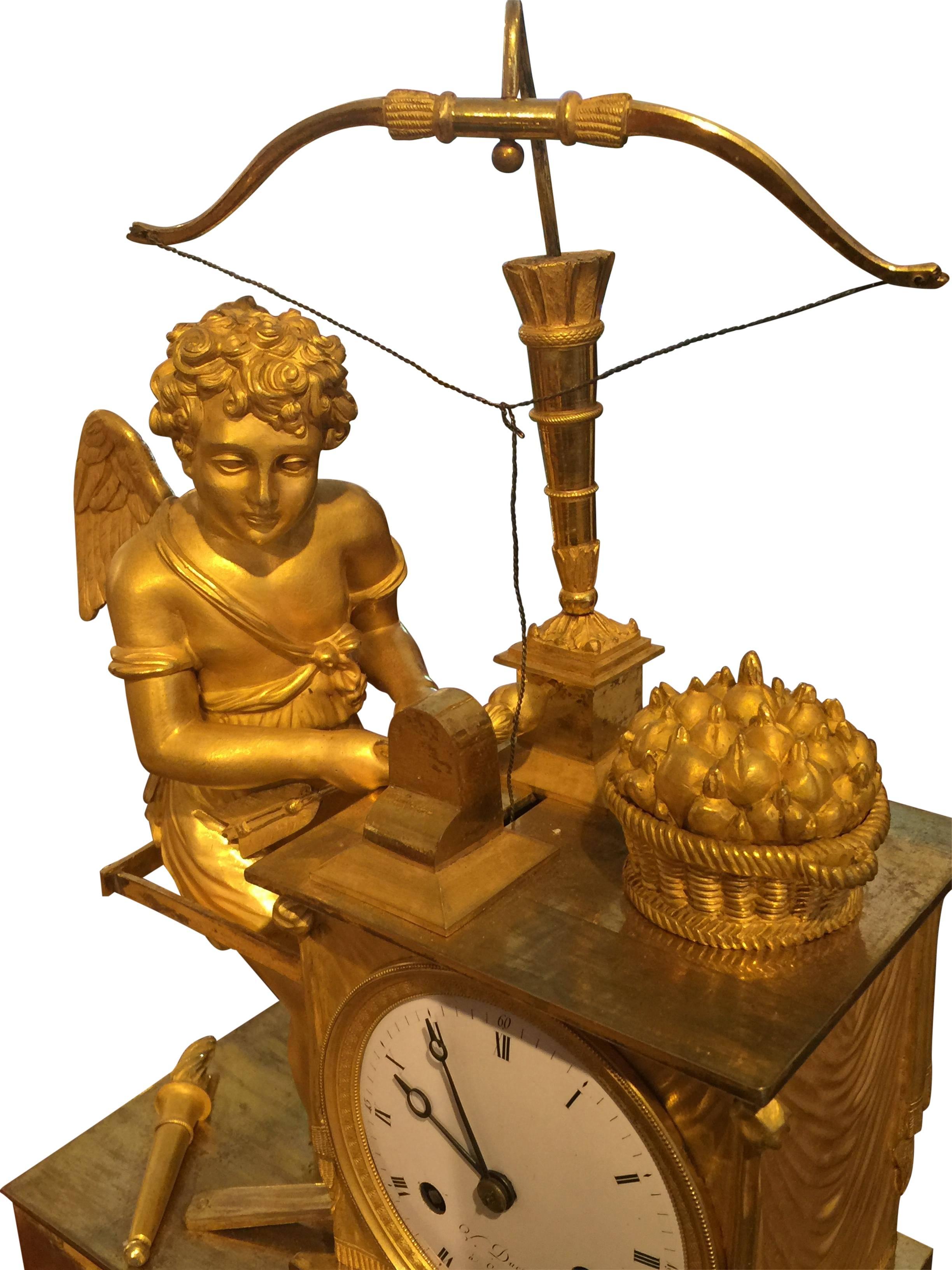 Empire French fireplace clock, bronze fire gold-plated, eight-day work, thread suspension, half-hour strike on bell, signed Ducommun.