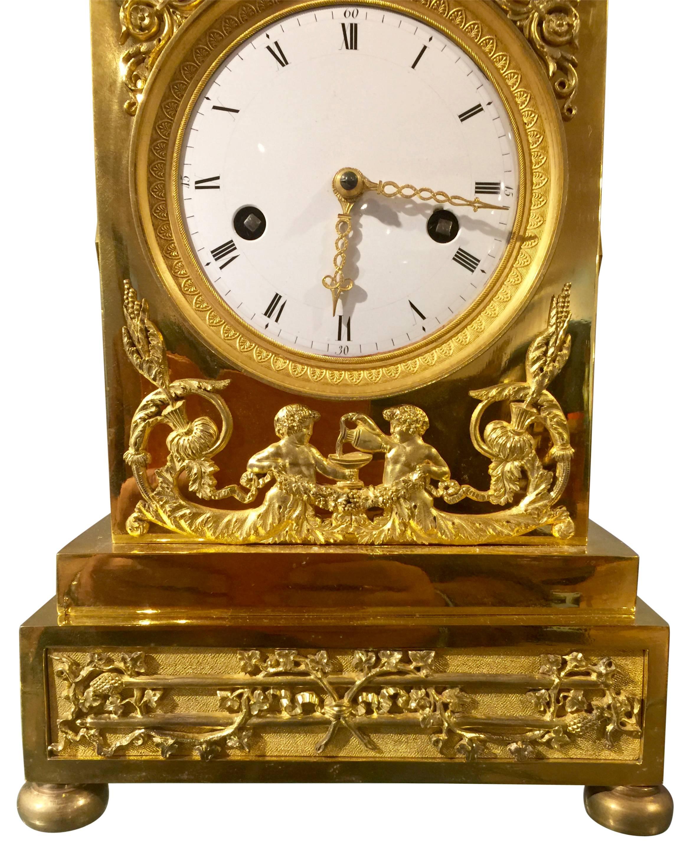 French mantel clock circa 1805, putti feeding lioness with grapes.
Bronze gilt eight day movement, half-hour strike on bell, pendulum to wire suspension.