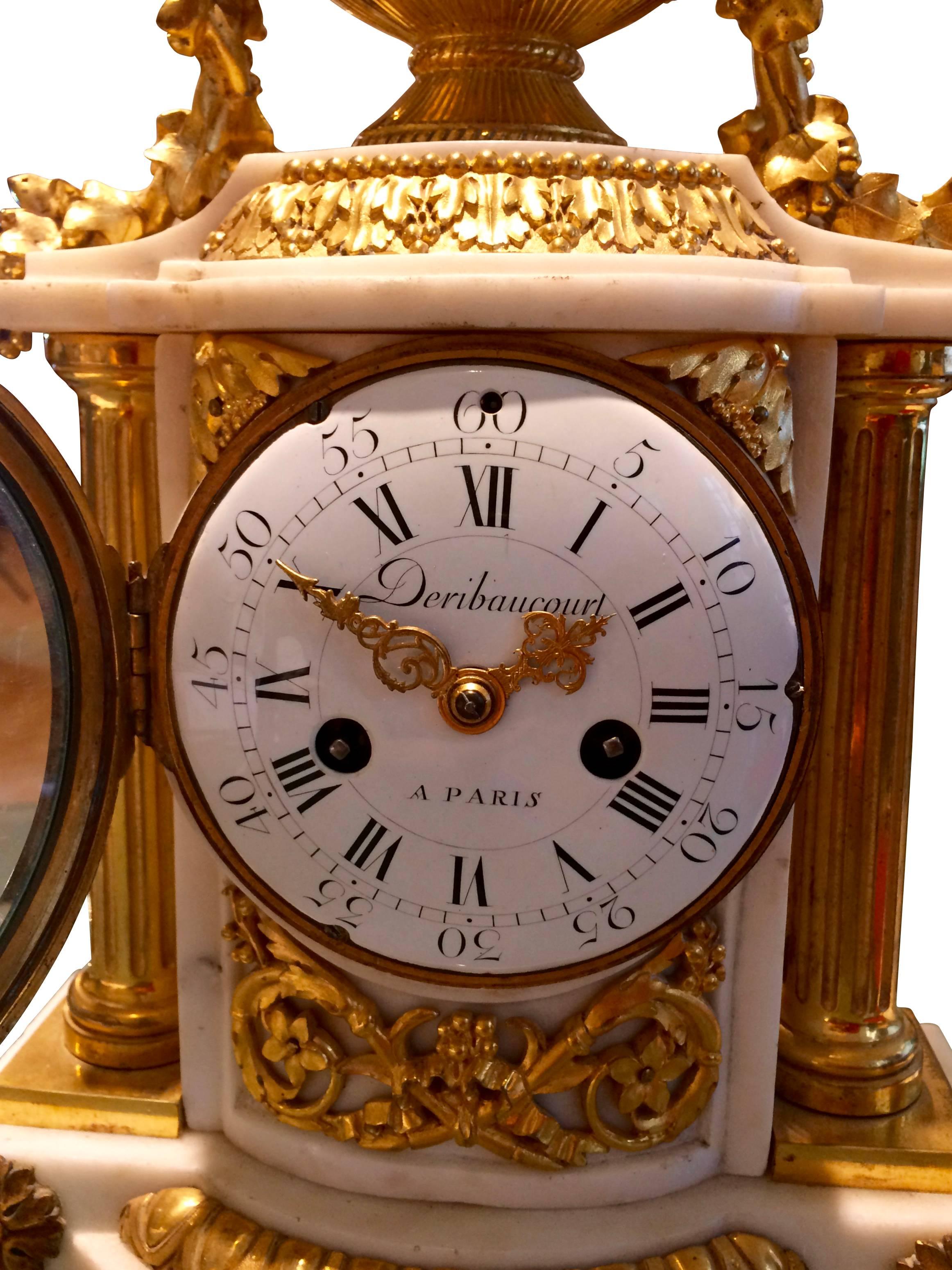 French chimney clock, circa 1780, Carrara marble with gilded bronze applications. Signed in the dial 
