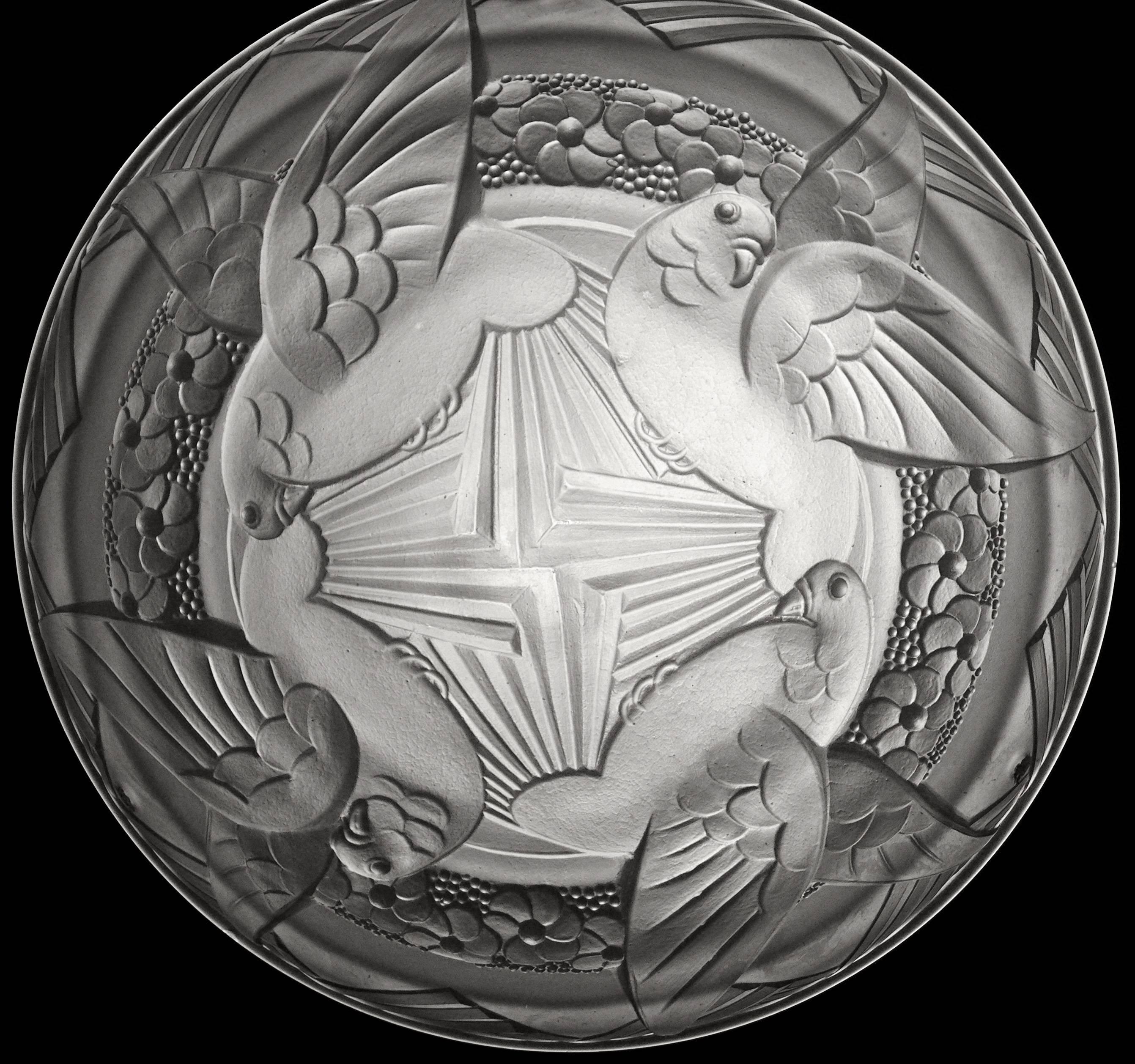 French Art Deco chandelier by Muller Freres, Luneville, late 1920s. Frosted molded glass shade. Four turtledoves (pigeons) in the sky. Original solid bronze and stamped metal (links) fixture. Signed "Muller Freres Luneville" on the shade