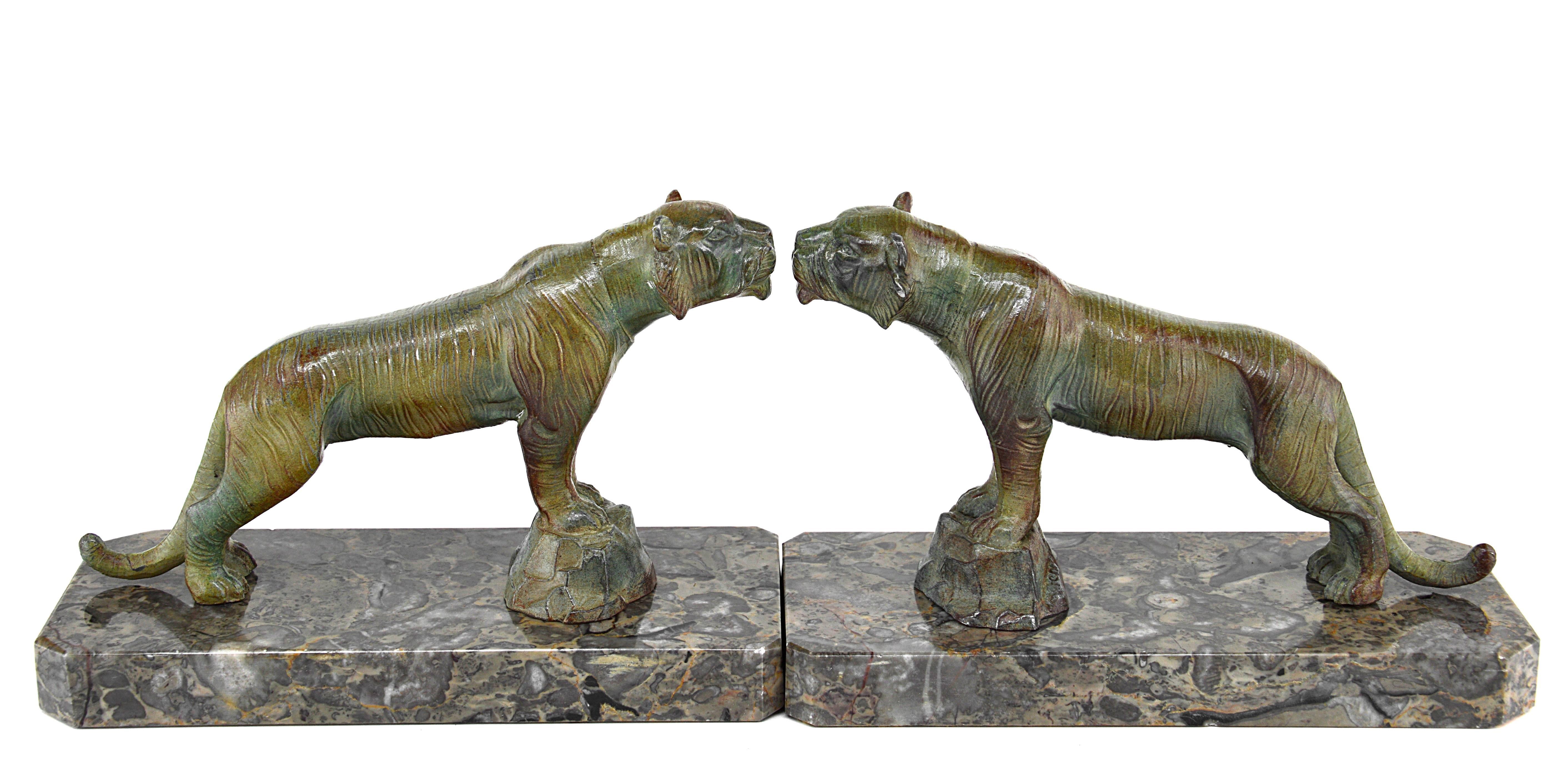 French Art Deco tiger bookends by Hippolyte Moreau, late 1910s. Two spelter tigers with their original patina on two beautiful marble bases. Signed 