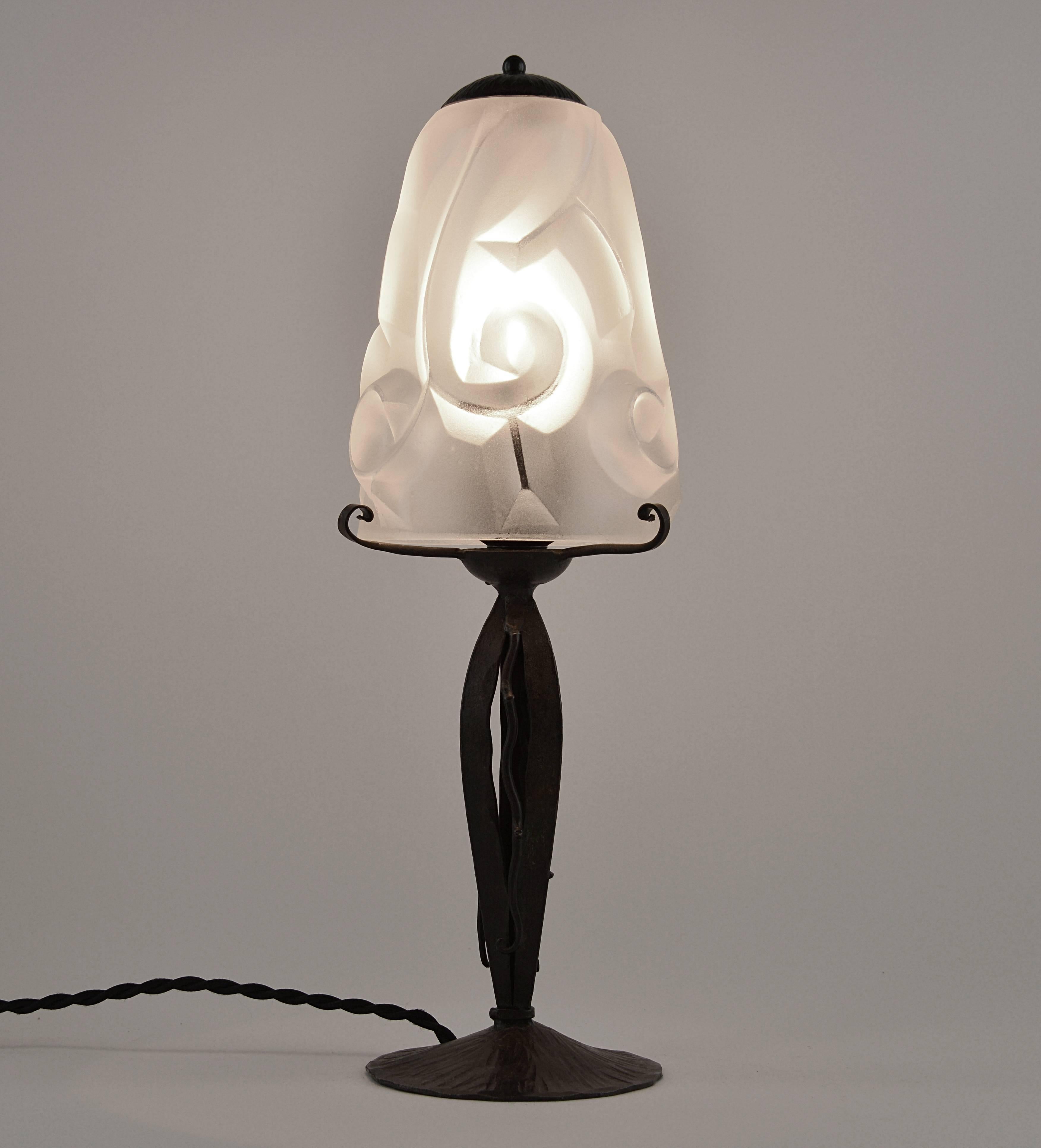 French Art Deco table lamp by Edouard Cazaux at Degue's, France, 1928-1930. Very thick molded glass shade. Superb wrought iron base. The best by Degue! The Degue of the Normandy liner. Delivered wired for your country.

About Edouard Cazaux