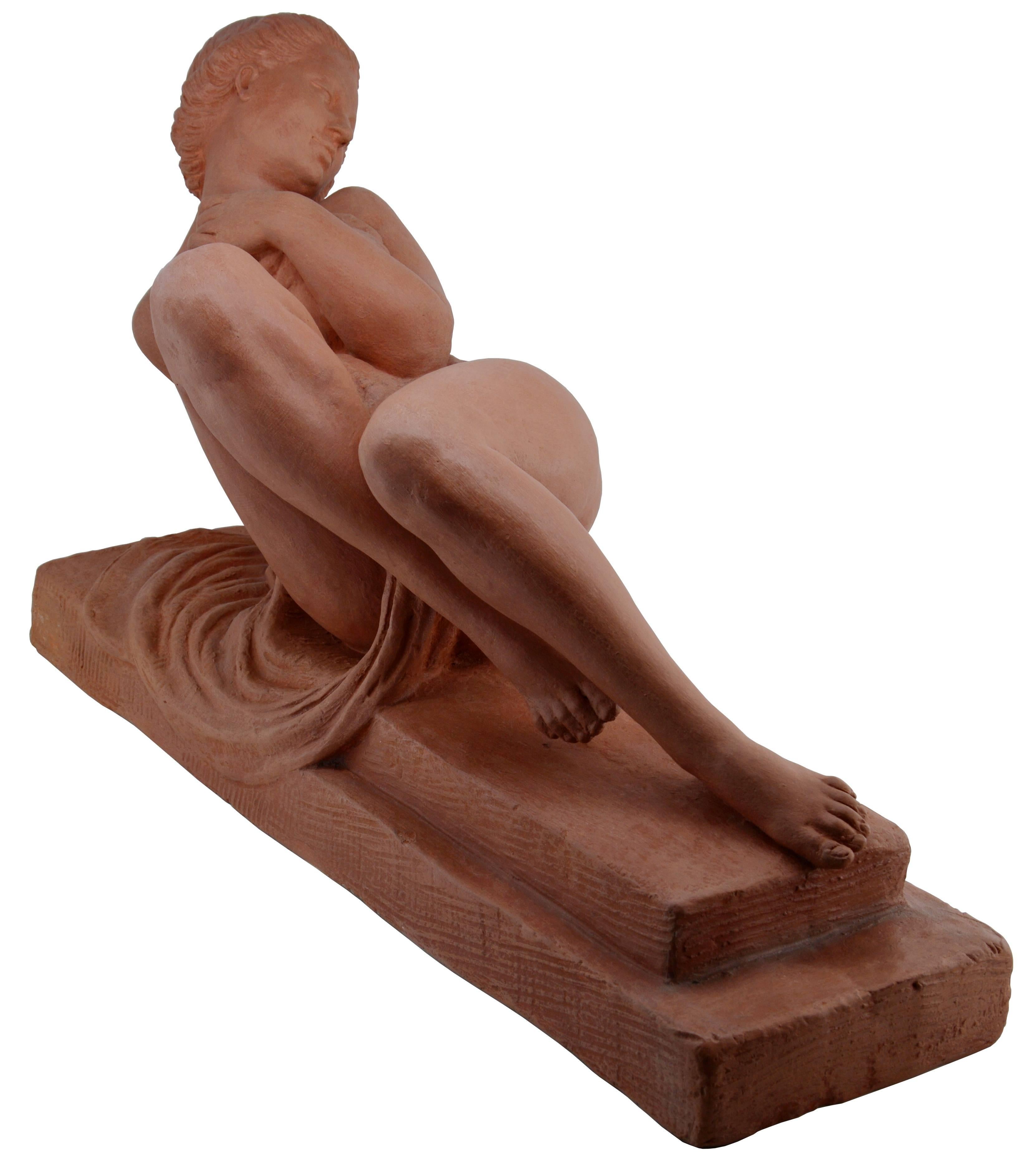 French Art Deco terracotta by Marcel Bouraine, France, circa 1925. Young woman laying down. Measures: Width 23.2