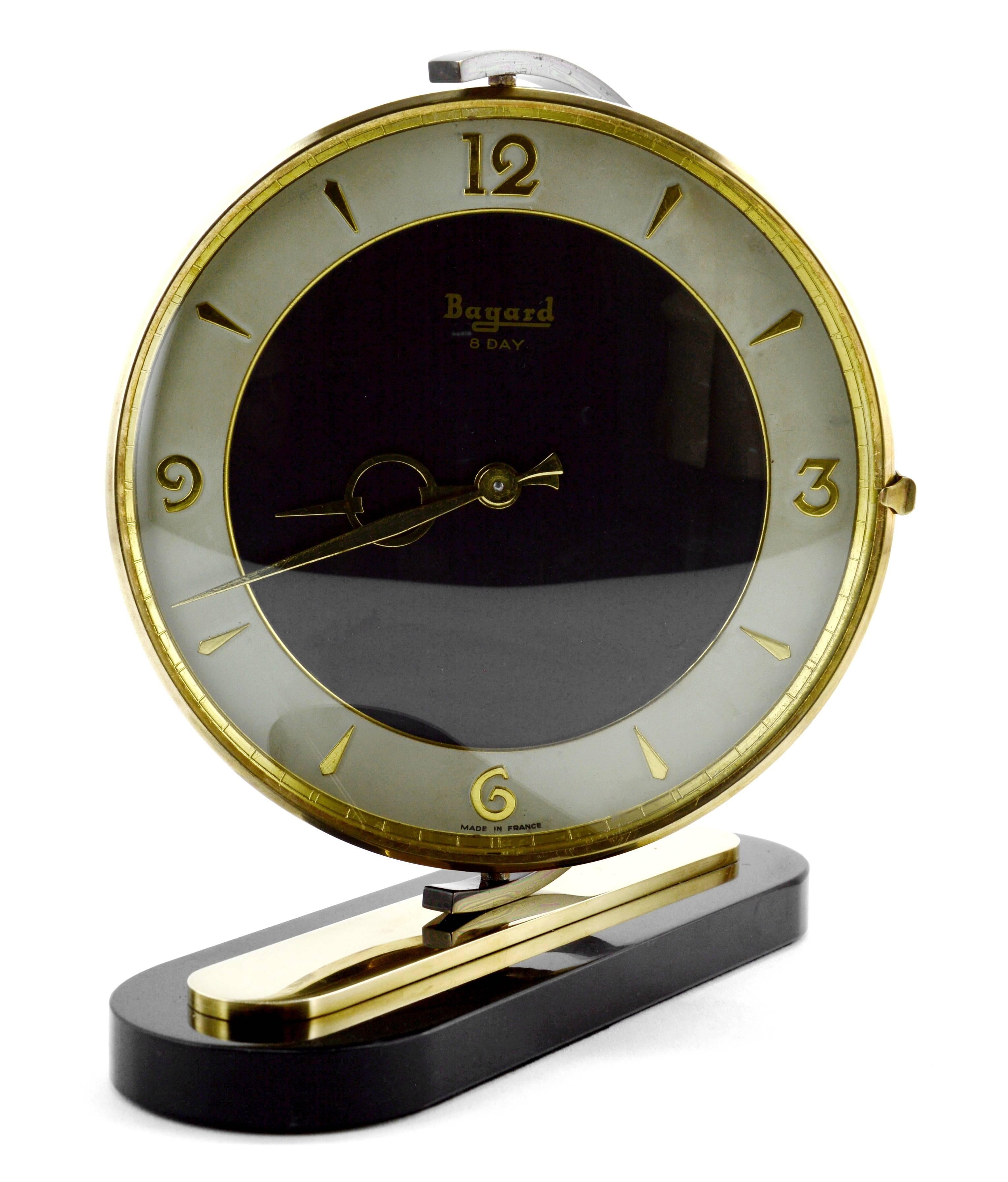 French Art Deco clock by Bayard, France, 1930s. Brass, marble and glass. Swivel brass dial. Marble base. Rounded glass. 8 days movement. Original mechanism. In perfect working order.