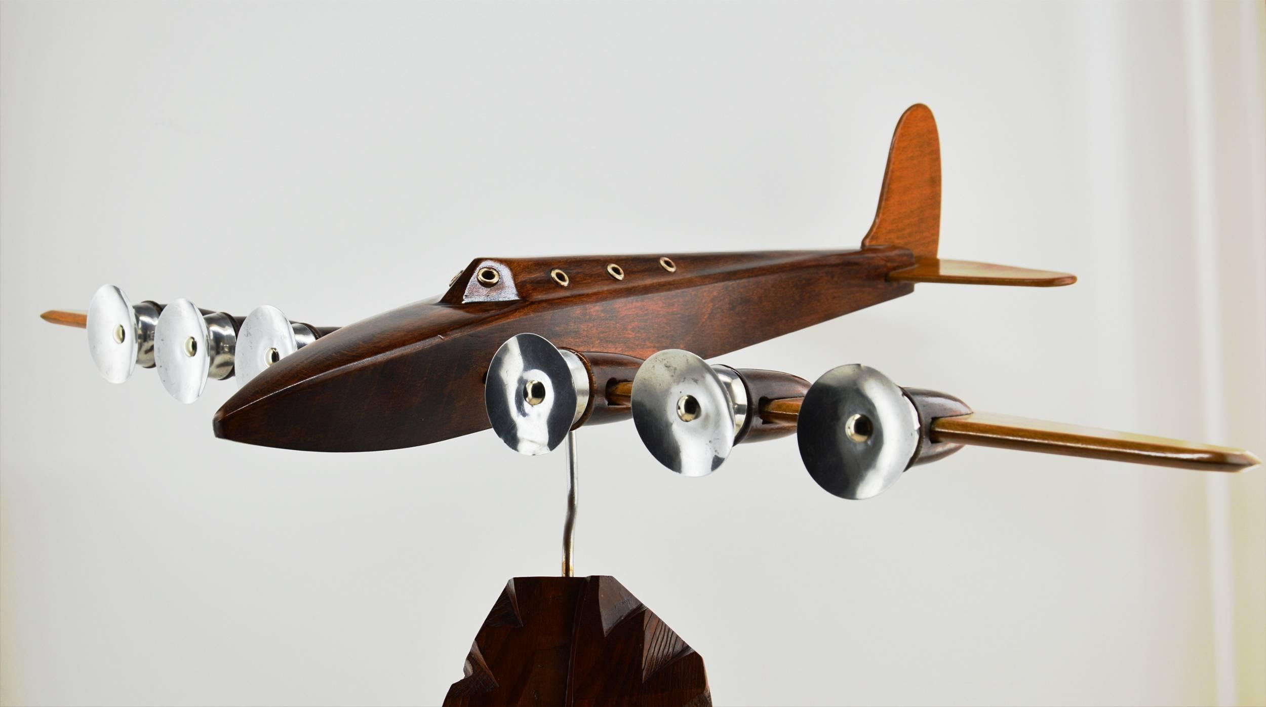 Large French Art Deco airplane model by Anthoine Art Bois, 1930s. Large wooden and metal swiveling airplane. Wingspan: 26"(66cm), length: 19.7"(50cm), height: 16.5"(42cm).