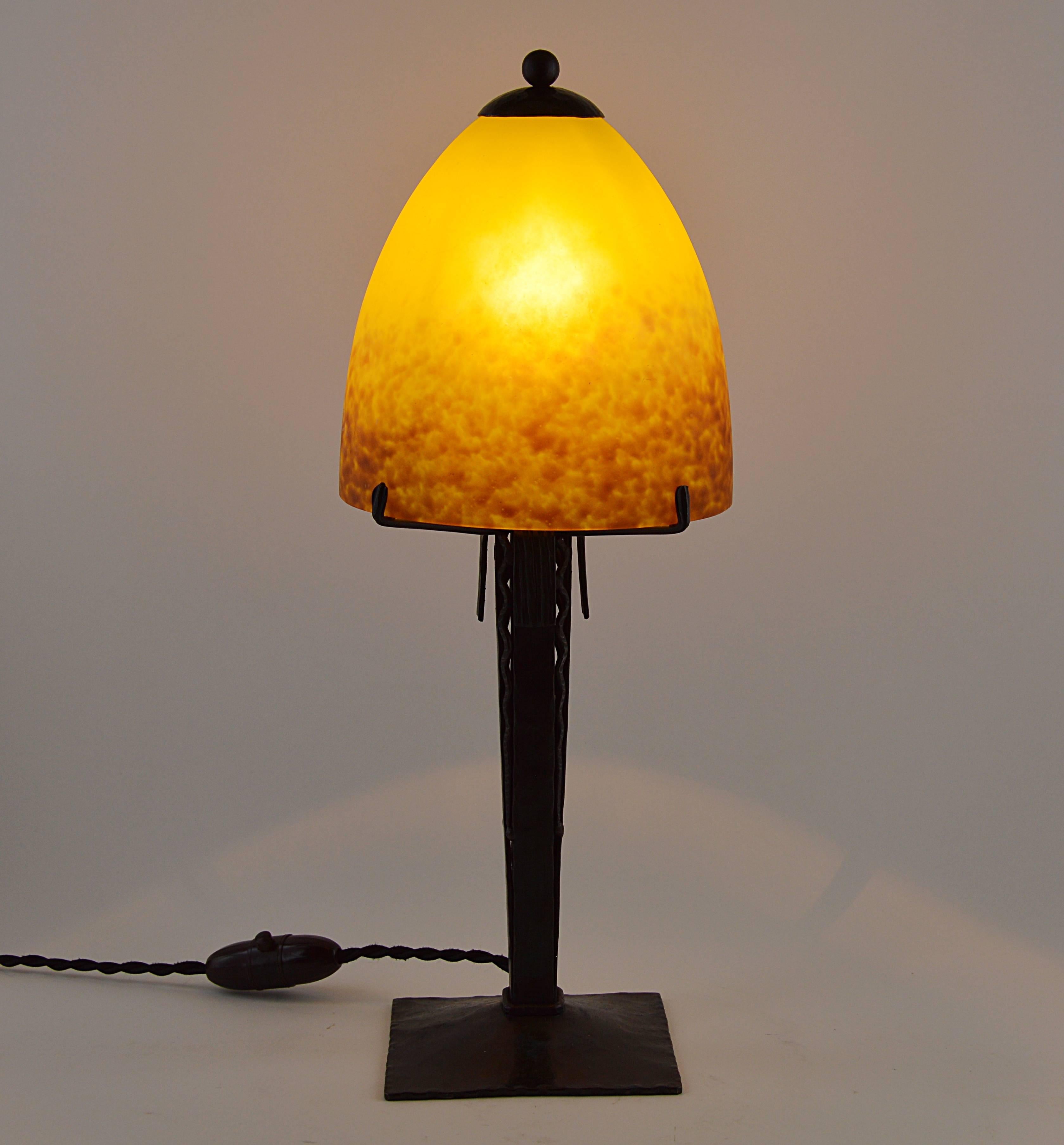 Take advantage of our nice summer prices. French Art Deco desk-table lamp by Andre Delatte, Jarville (Nancy), late 1920s.The shade is made of blown double glass with powder application between both layers. Colors are yellow and brown. The shade