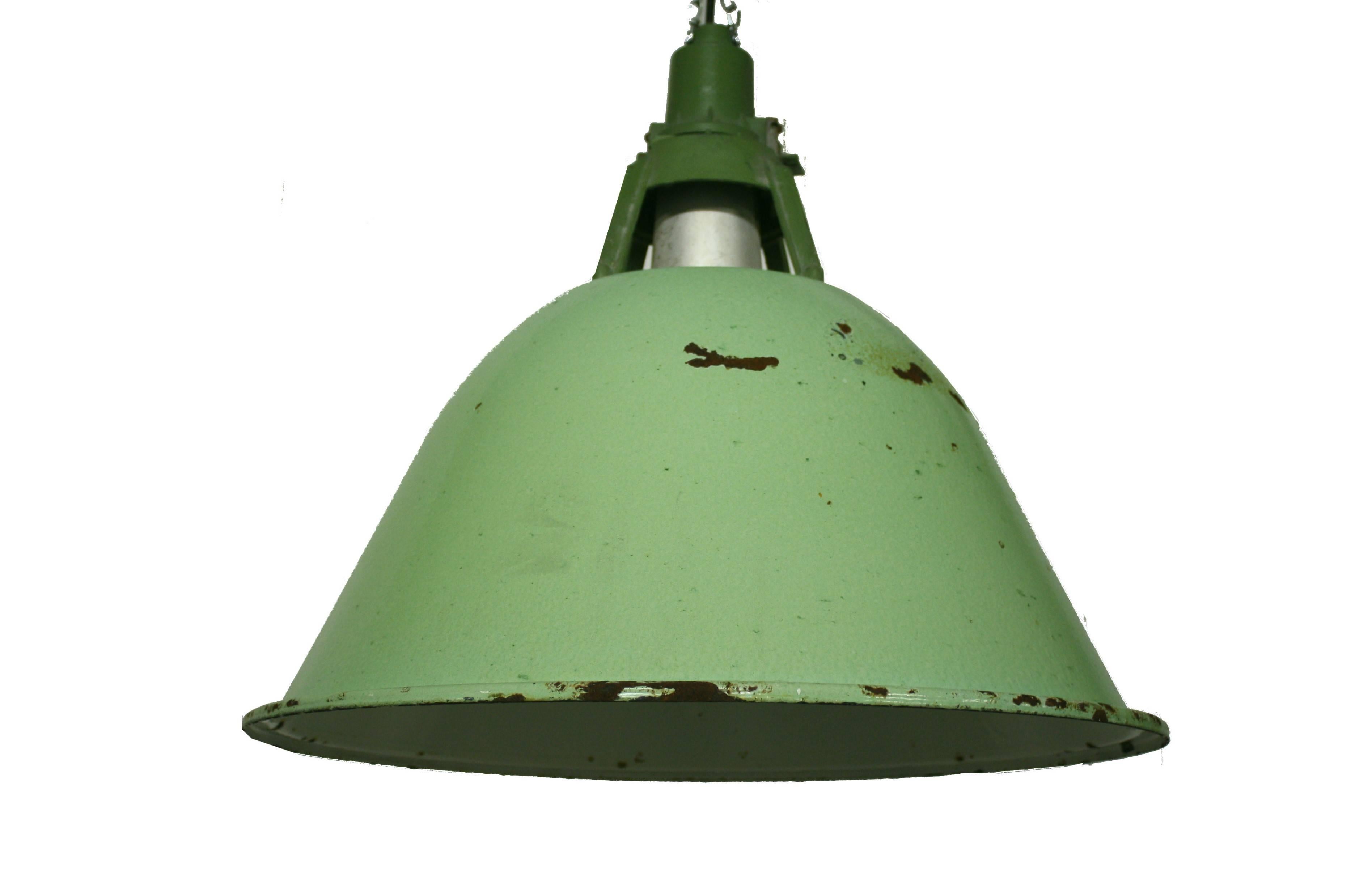 Large vintage Industrial pendant lights.

The lamps are made of light green enamel and have cast iron shade holders.

These vintage factory lamps are unusually large and were removed from a very big warehouse in Russia or Latvia.

They come in