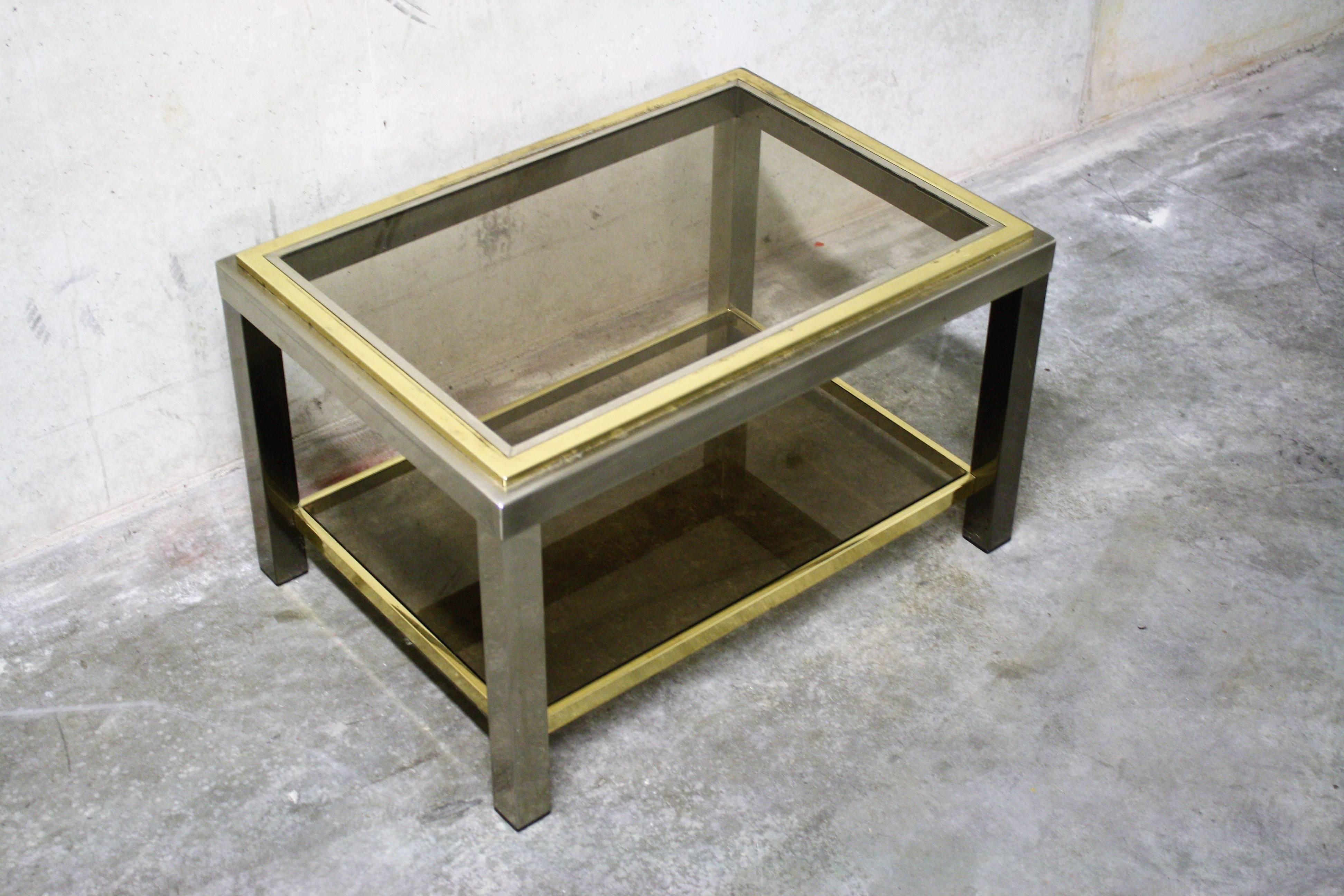 Vintage side table made from brass and chrome with two-tier smoked glass.

Good condition of the brass and the chrome, original glass.

1970s France

Measures: Height: 40 cm
Width: 65 cm
Depth: 48 cm.