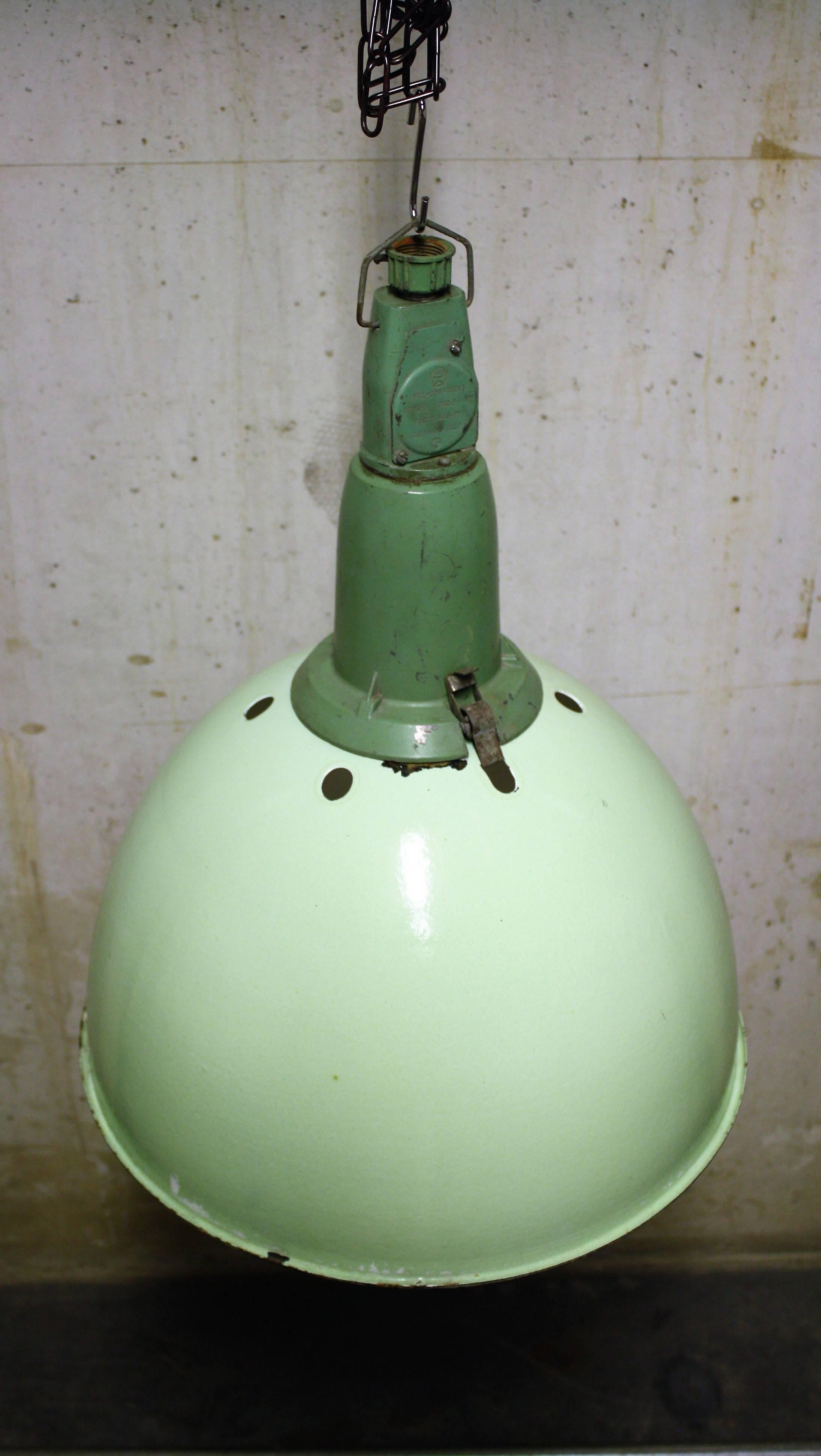 Vintage green Industrial pendant lights.

These enamel lamps used to hang in large factory buildings, offices and warehouses.

They where popular due to their shape which made it possible to mass produce them cheaply.

Originally they where