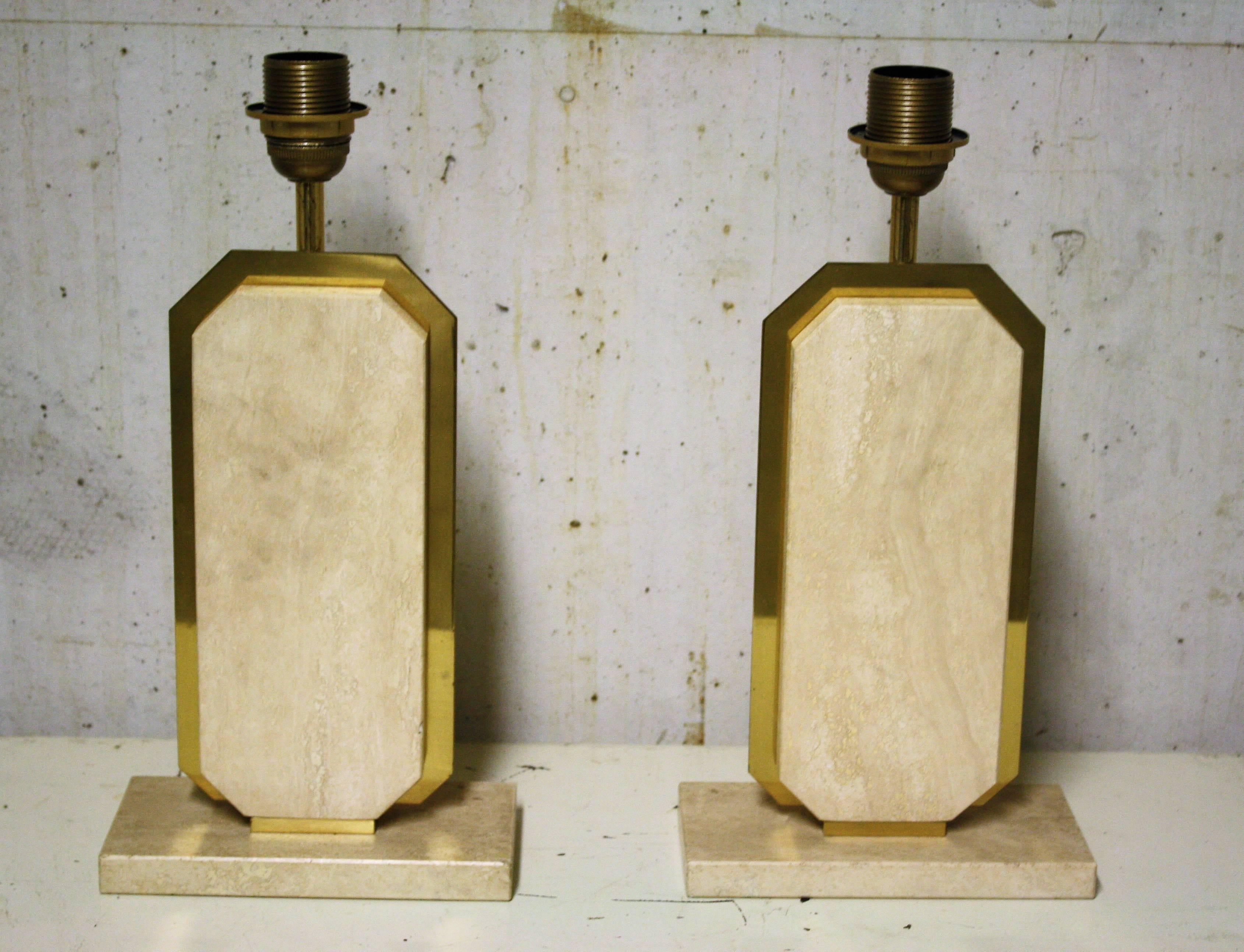 Pair of heavy travertine table lamps with brass.

This pair looks charming and the materials and design make it still look fresh today.

The travertine stone has a beautiful color.

Travertine is usually found in Italy. The colosseum is one of