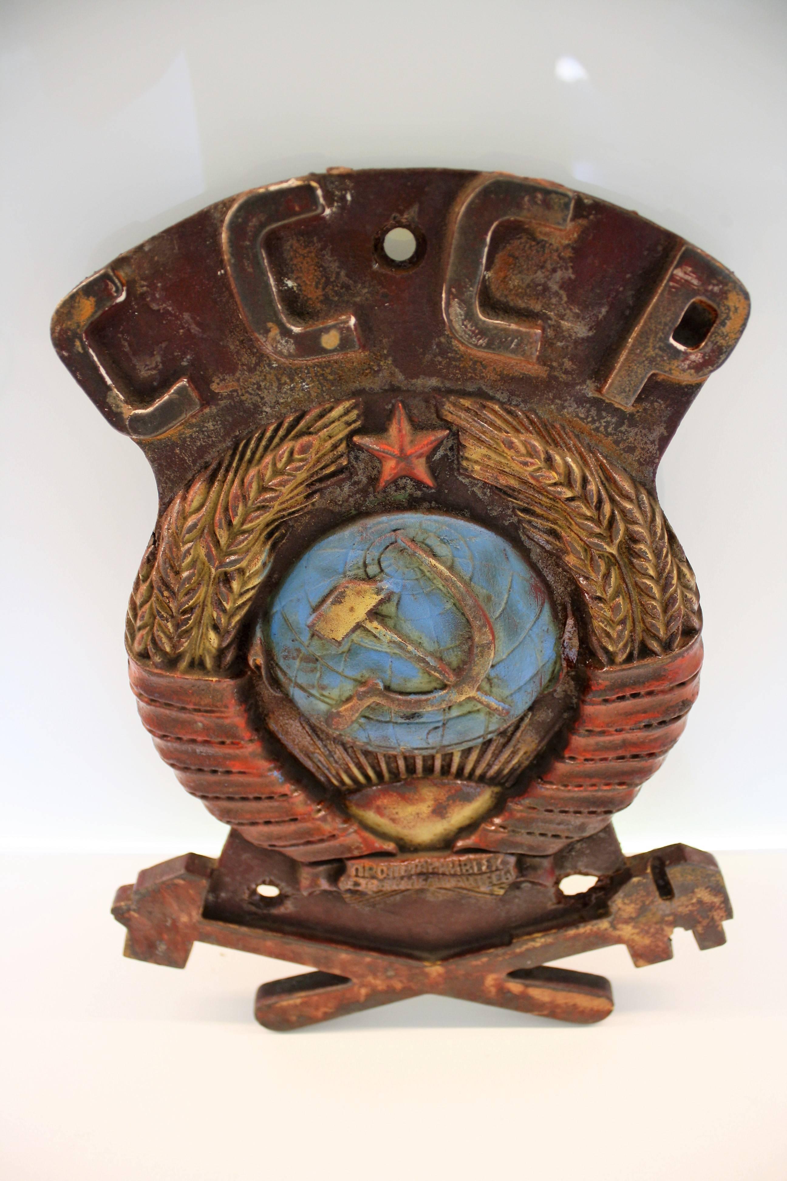 This rather extraordinary cast iron USSR sign was salvaged from the front of a russian locomotive.

An exclusive decorative piece with a statement.

It says CCCP which stands for USSR.

The worn but still visible colours and the detailed logo