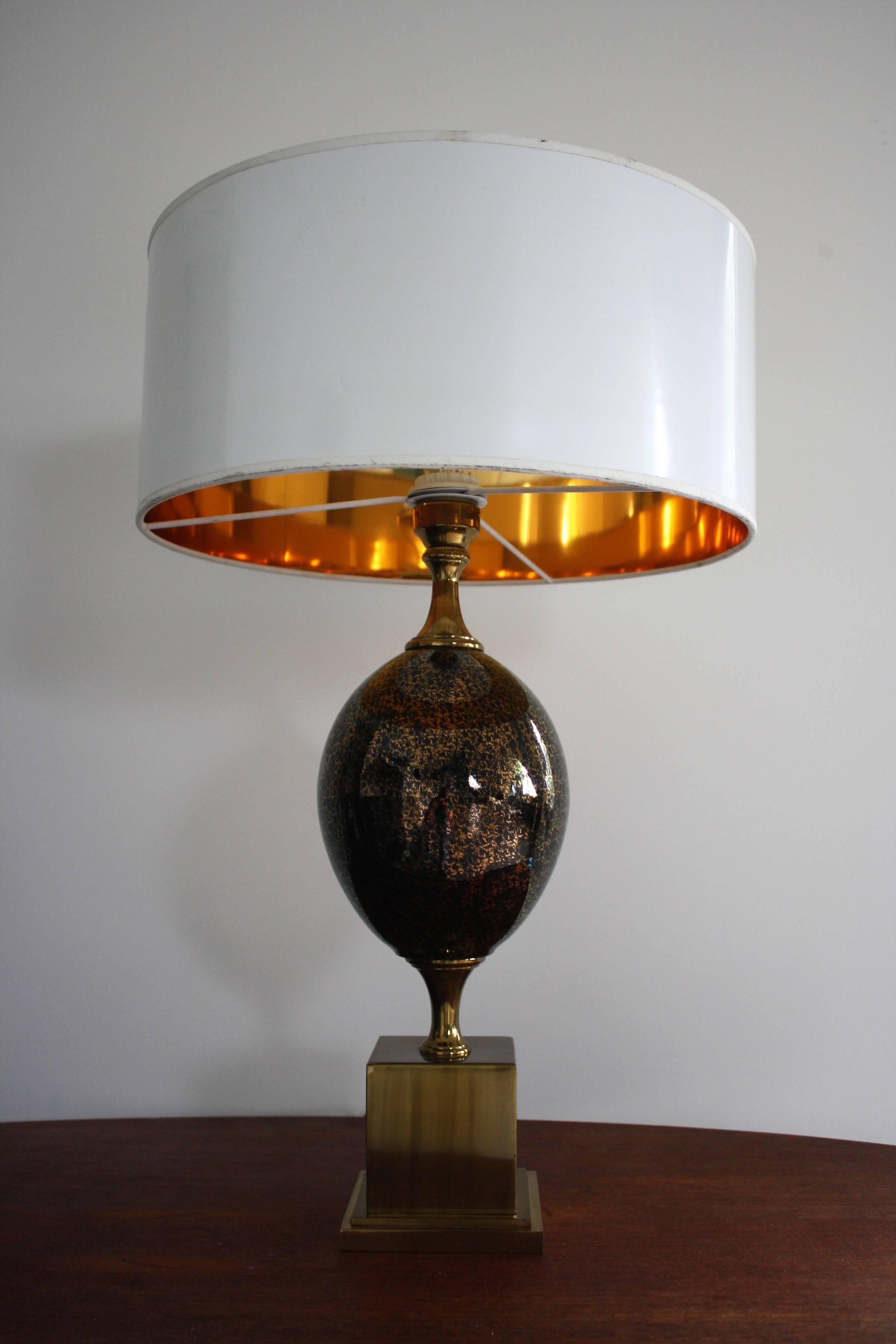 Brass egg table lamp by Maison Barbier

The egg has a lovely gold and black finish that comes to live when the light is on.

The lamp is delivered with a white shade with a golden interior to transmit warm cosy light.

A really stylish and