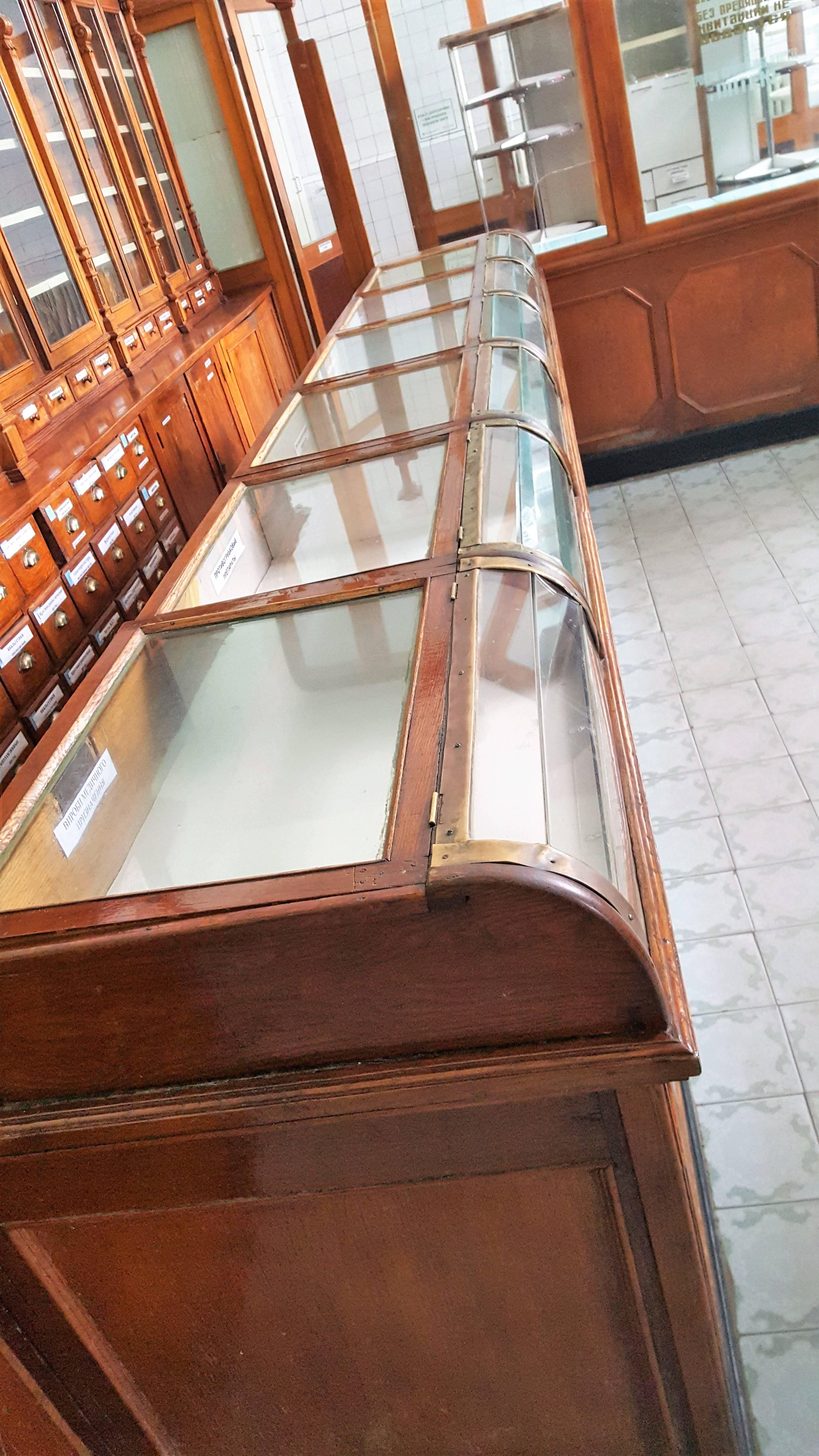 Up for sale is an absolutly stunning complete interior of an 19th century Russian chemist shop.

The collection is made from oak, pinewood and glass and consists of:

A beautifully finished main storage cabinet with five double door storage