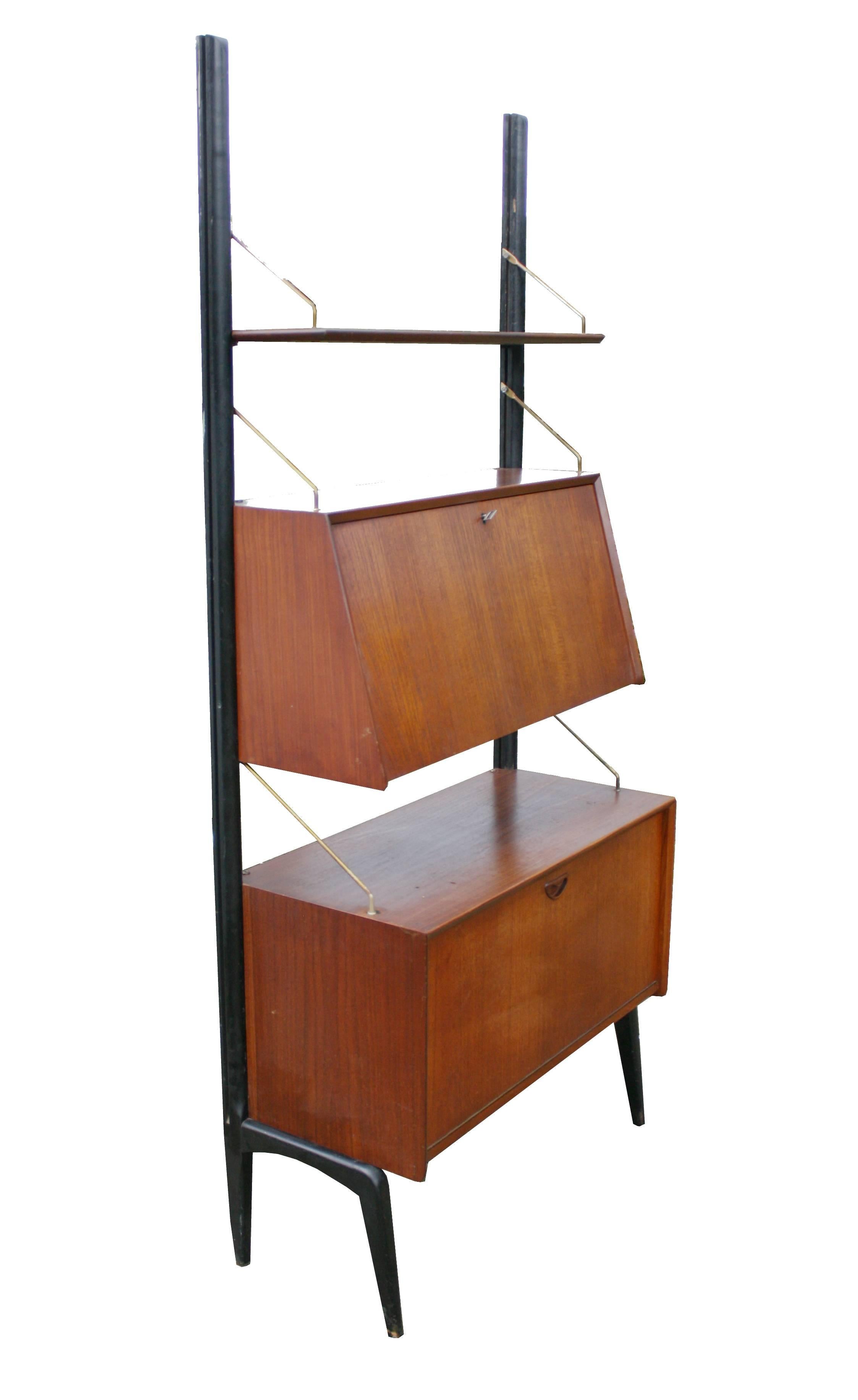 Stylish freestanding modular wall unit by Louis Van Teeffelen for Webe, 1958.

This freestanding modular wall unit was designed by Louis van Teeffelen for Wébé in the 1950s. This unit features an adjustable teak shelve and a secretary and liquor