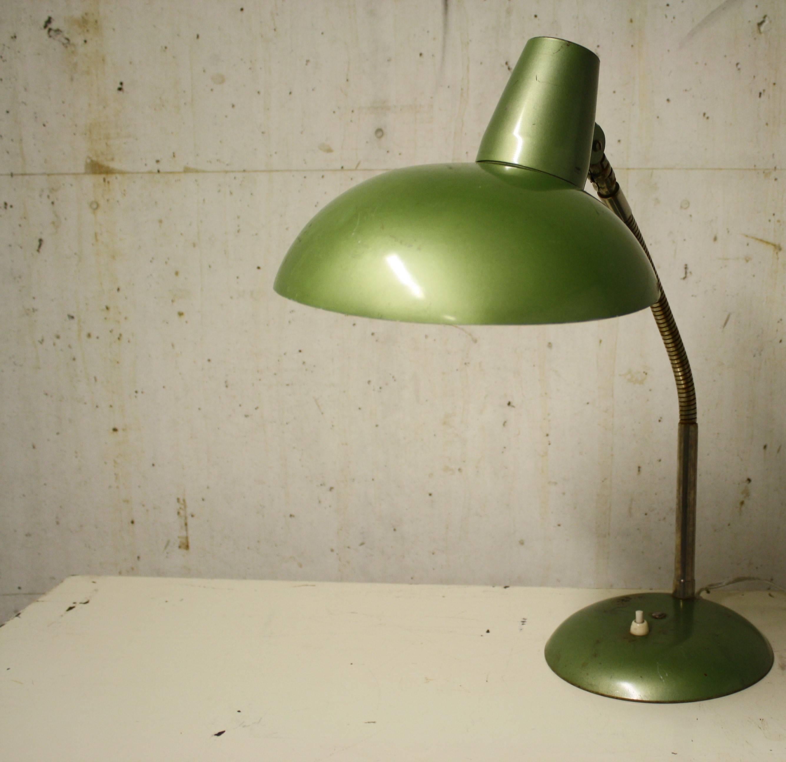 Green Bauhaus desk lamp - Industrial desk lamp

This 1930s table lamp has a rather unusual green colour which is both charming an easy to place in your interior.

It is articulated and can be adjusted easily to fit your needs.

Good condition,