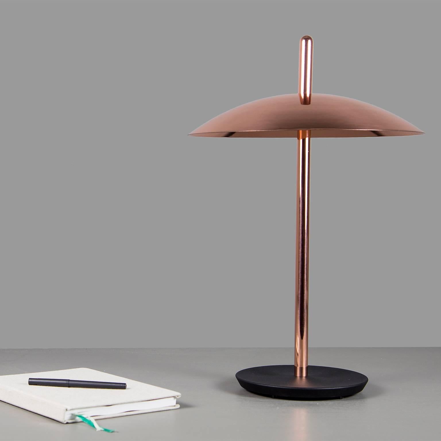 The signal table lamp is familiar, yet futuristic. From beneath it’s spun metal shade LEDs cast a warm and inviting glow onto a polished central stem grounded by a cast iron base. With it’s refined form and multiple finish options the signal table