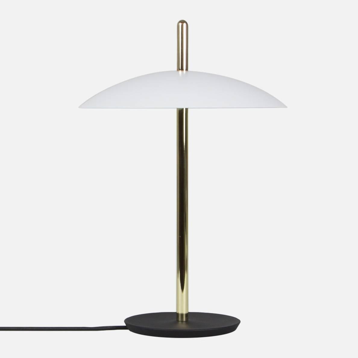 The signal table lamp is familiar, yet futuristic. From beneath it’s spun metal shade LEDs cast a warm and inviting glow onto a polished central stem grounded by a cast iron base. With it’s refined form and multiple finish options the signal table