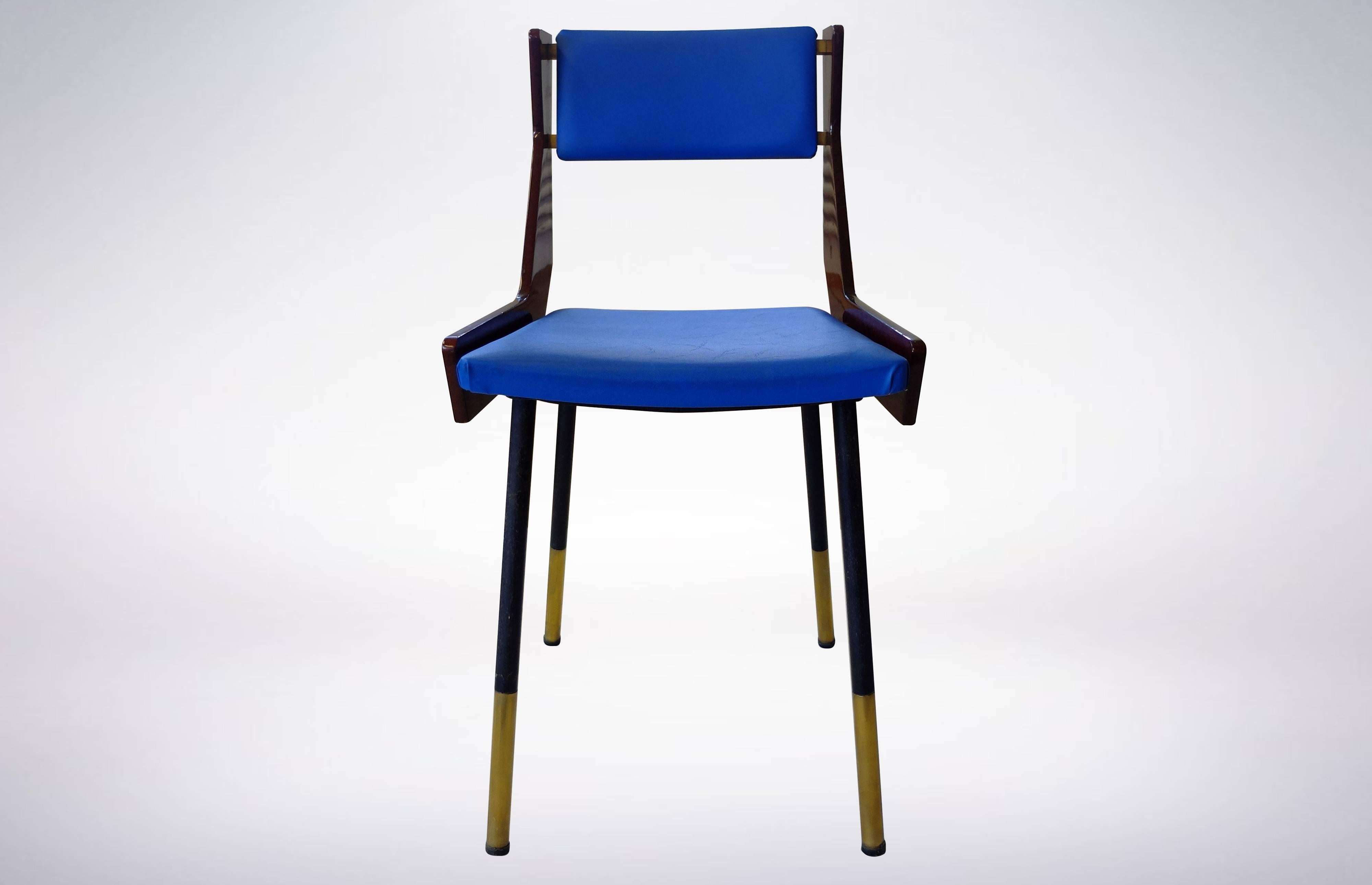 Rare exemplars of six chairs created by Gianfranco Frattini in the 1950s, upholstered in lush blue leather, with elegant brass details on the sides.