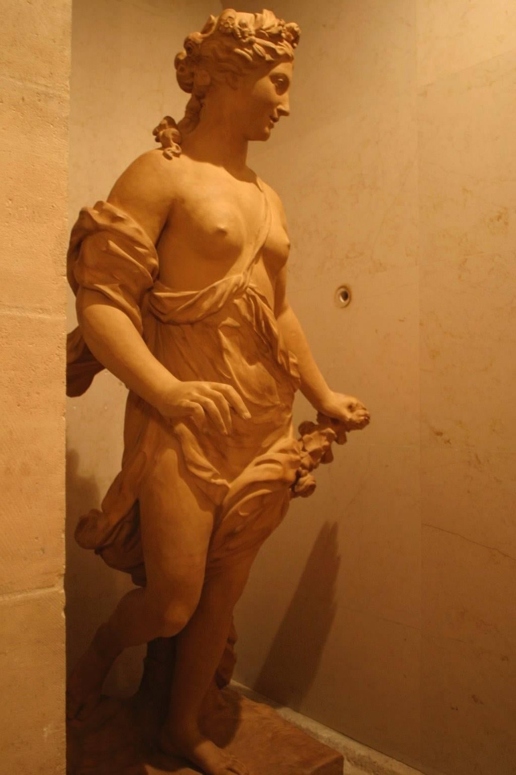Art reproduction in terracotta after an 18th century model, manufactured circa 2016
Flora (1706-1709.) 
René Frémin (1672-1744) 180 x 80 x 80 cm.
Base: 63 x 58 cm, Louvre.
Frémin studied with the two greatest sculptors to have worked at