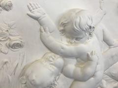 Bas Relief In Plaster Children playing on a swing