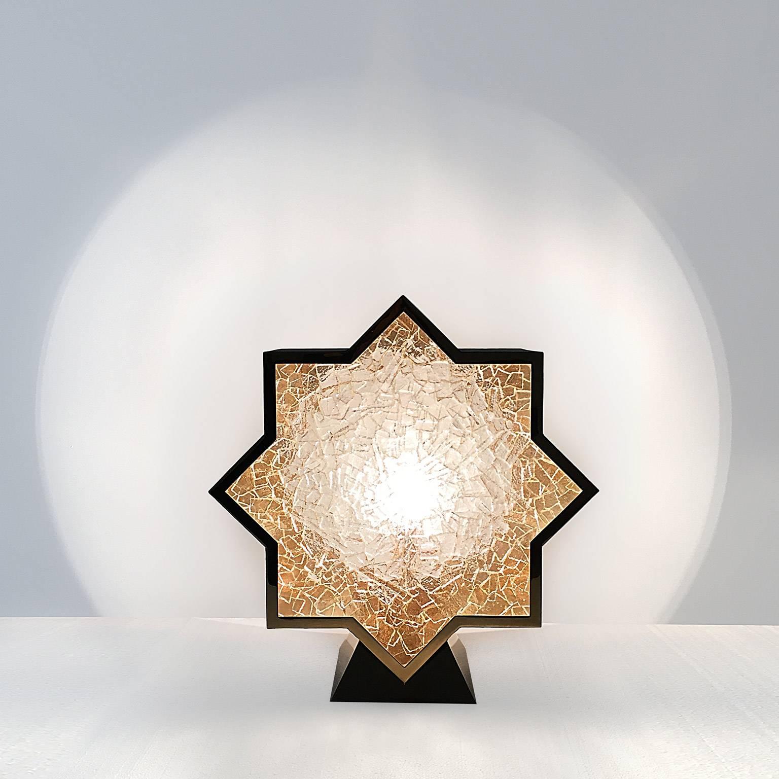 Star table lamp in gold gilt brass, fused glass screen and blue suede.
An adjustable moon pattern is projected on the wall behind the lamp when the switch is on.

Prototype N°1/2 available
The pieces are signed and numbered.

About PiSigma:
Symbolic