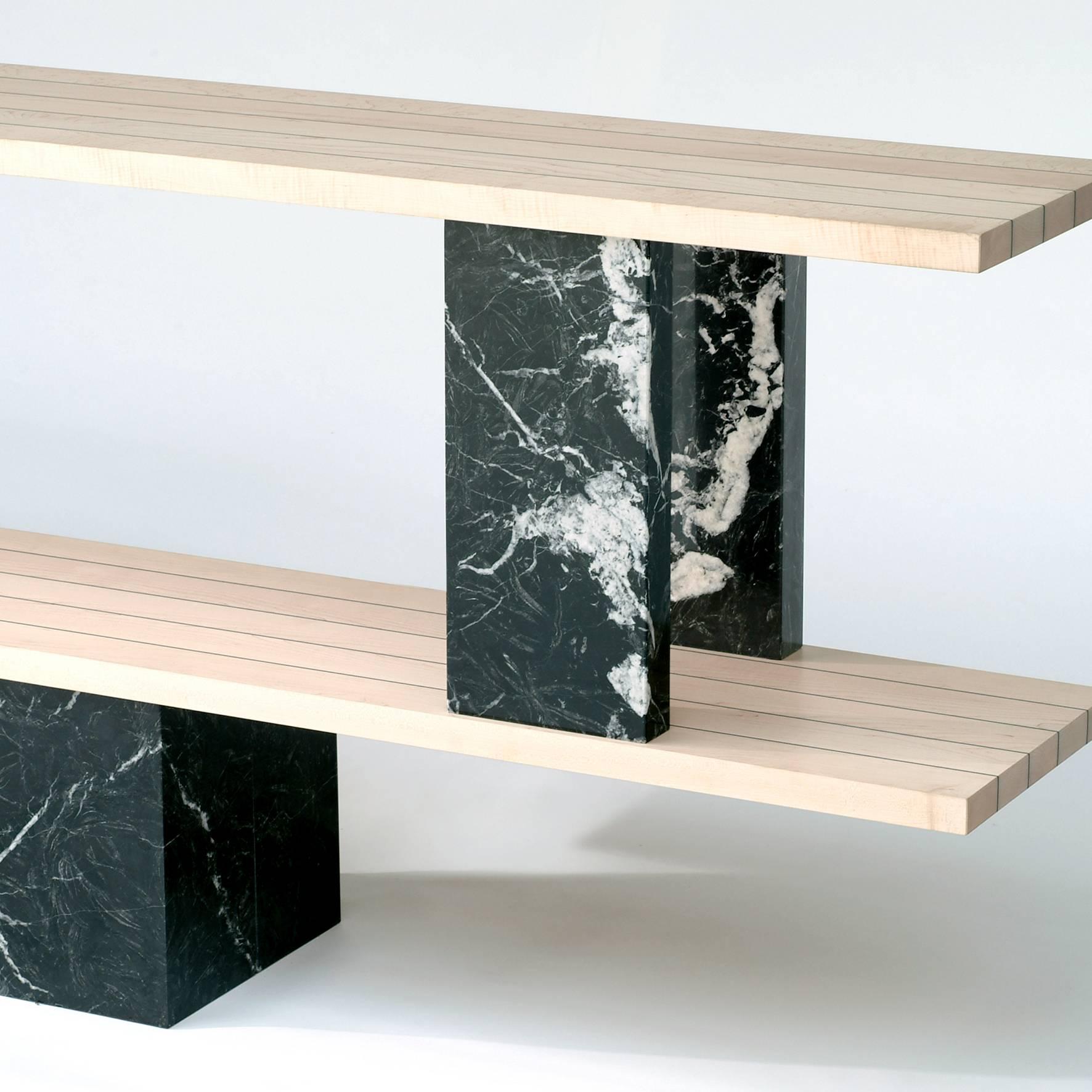 The ether console shelf is a balance challenge between fullness and emptiness. It is made of five dismantable pieces. The stability of the object is ensured by marble, which is a natural rock.
- Materials: Marquina marble, maple wood (Also
