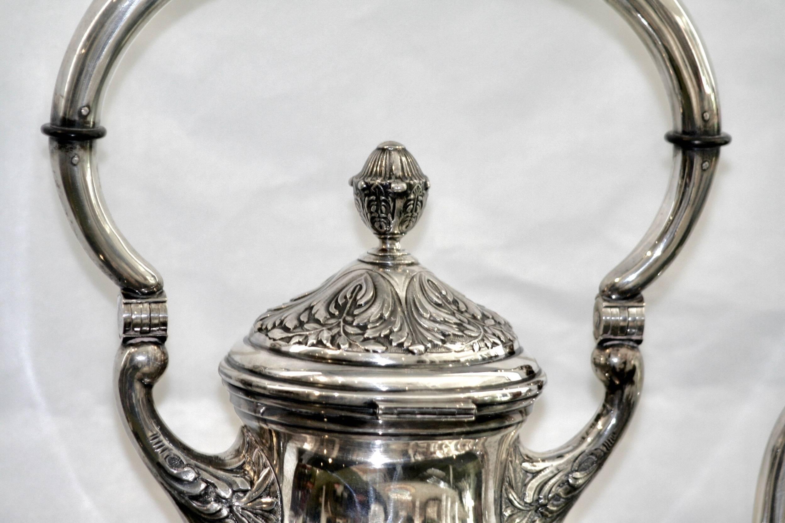 19th century English silver samovar. Large teapot with lid. Formed by three parts (teapot 32 cm. without lid, 37 with lid), strutting’s and with chafing-dish.