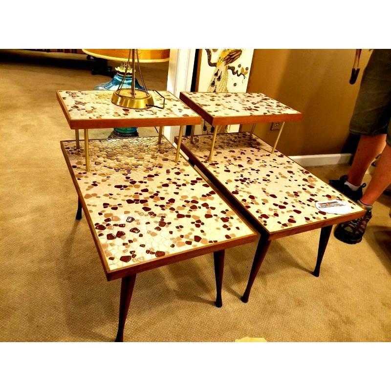 These Wonderful tables have a gorgeous purple pebble mosaic top. The pebbles range from white or pink to a dark purely brown color. They are in amazing condition. No flaws.

Measurements:

Tall 23