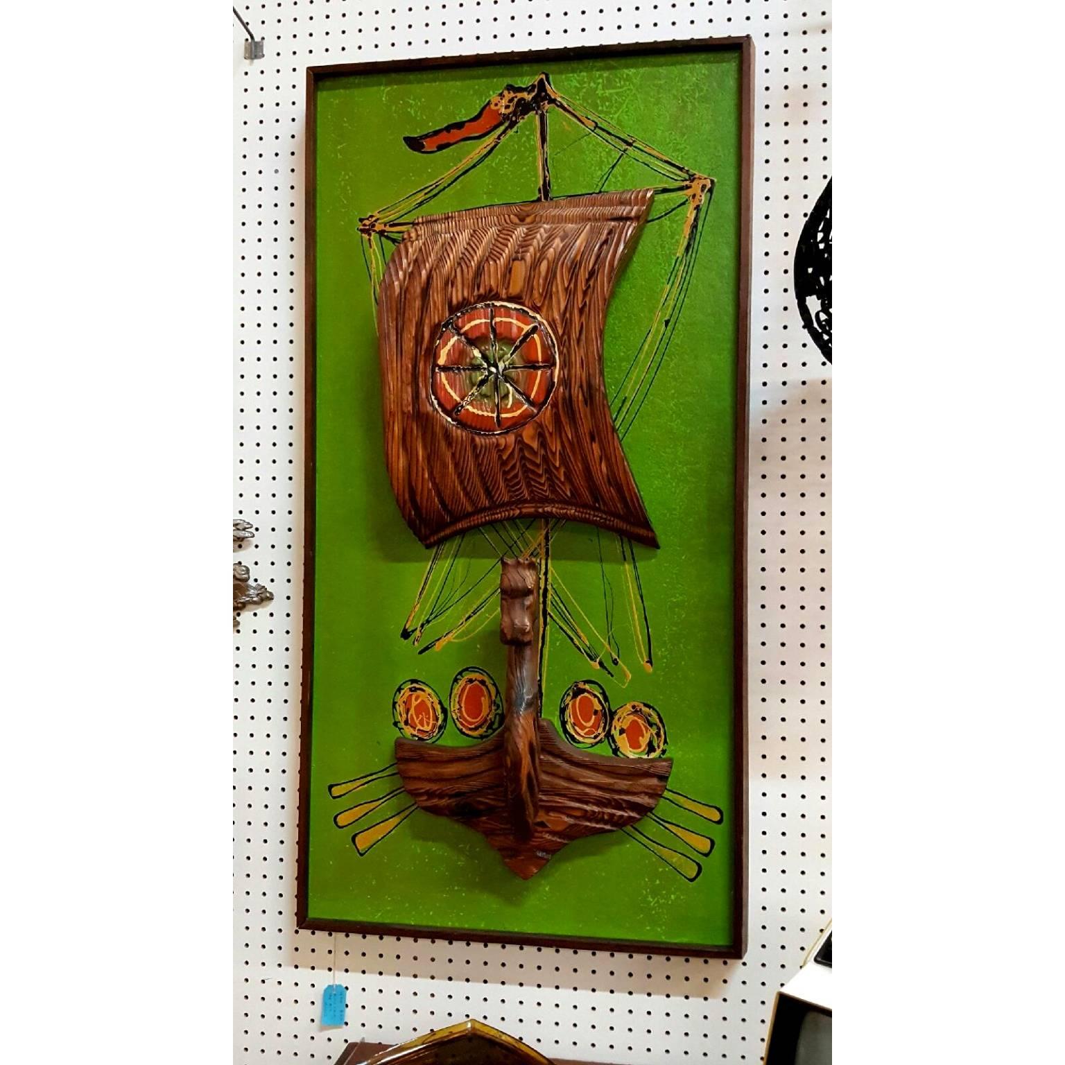 This Witco art piece does not have a signature on it.  The sail is 3D and juts out of the painting.  The bottom of the boat is carved the front is a horse.  This is hand painted.  Really cool vintage Witco art painting.  

Measurements 
24 x 48