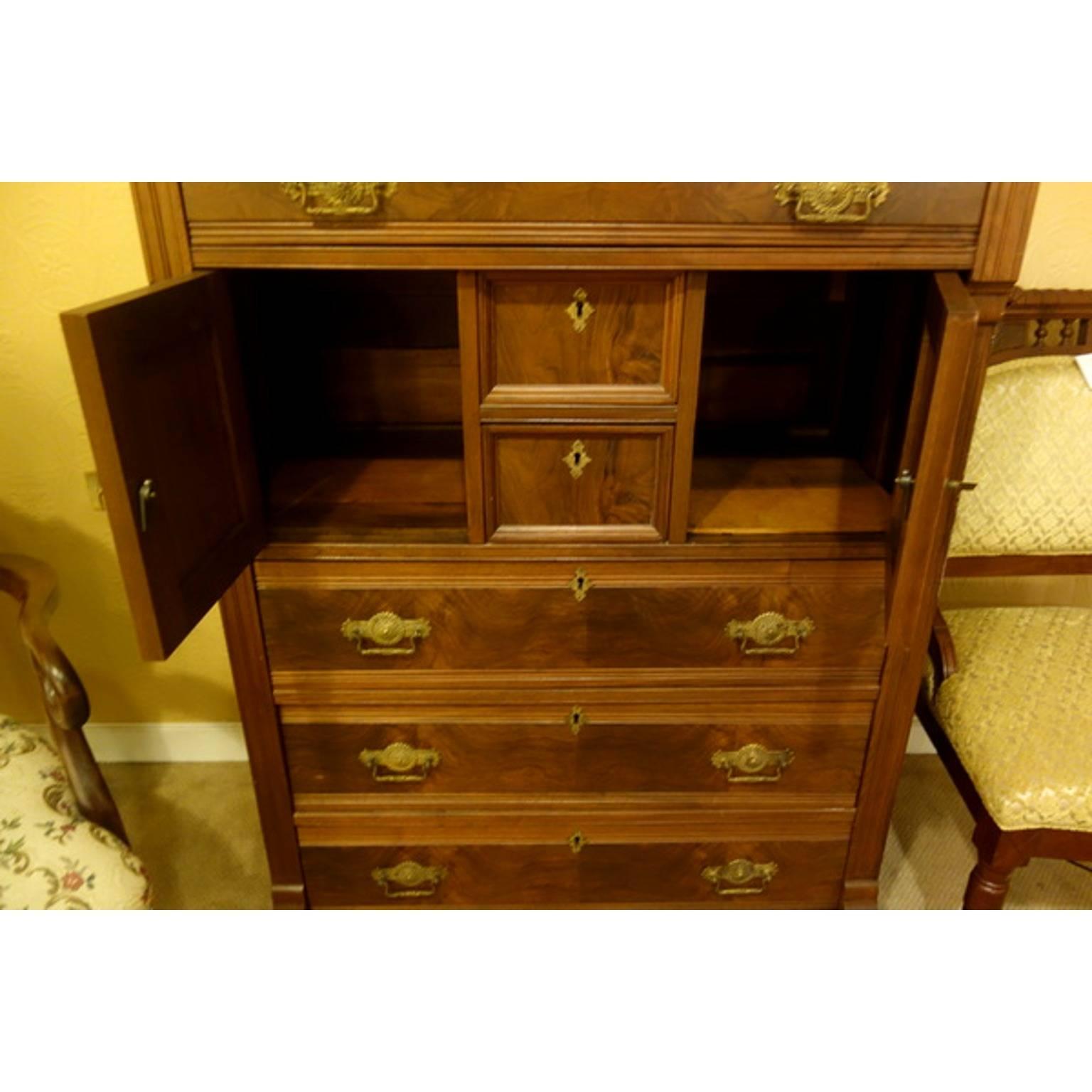 This is a unique piece and it comes with the original key.  I believe that this was a man's vanity dresser.  You would put a bowl with water on one side and shaving utility in the other side.  Very cool dresser and would look great in any room.