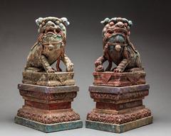Chinese Pair of Polychromed Stone Fu Dogs from the Ming Dynasty